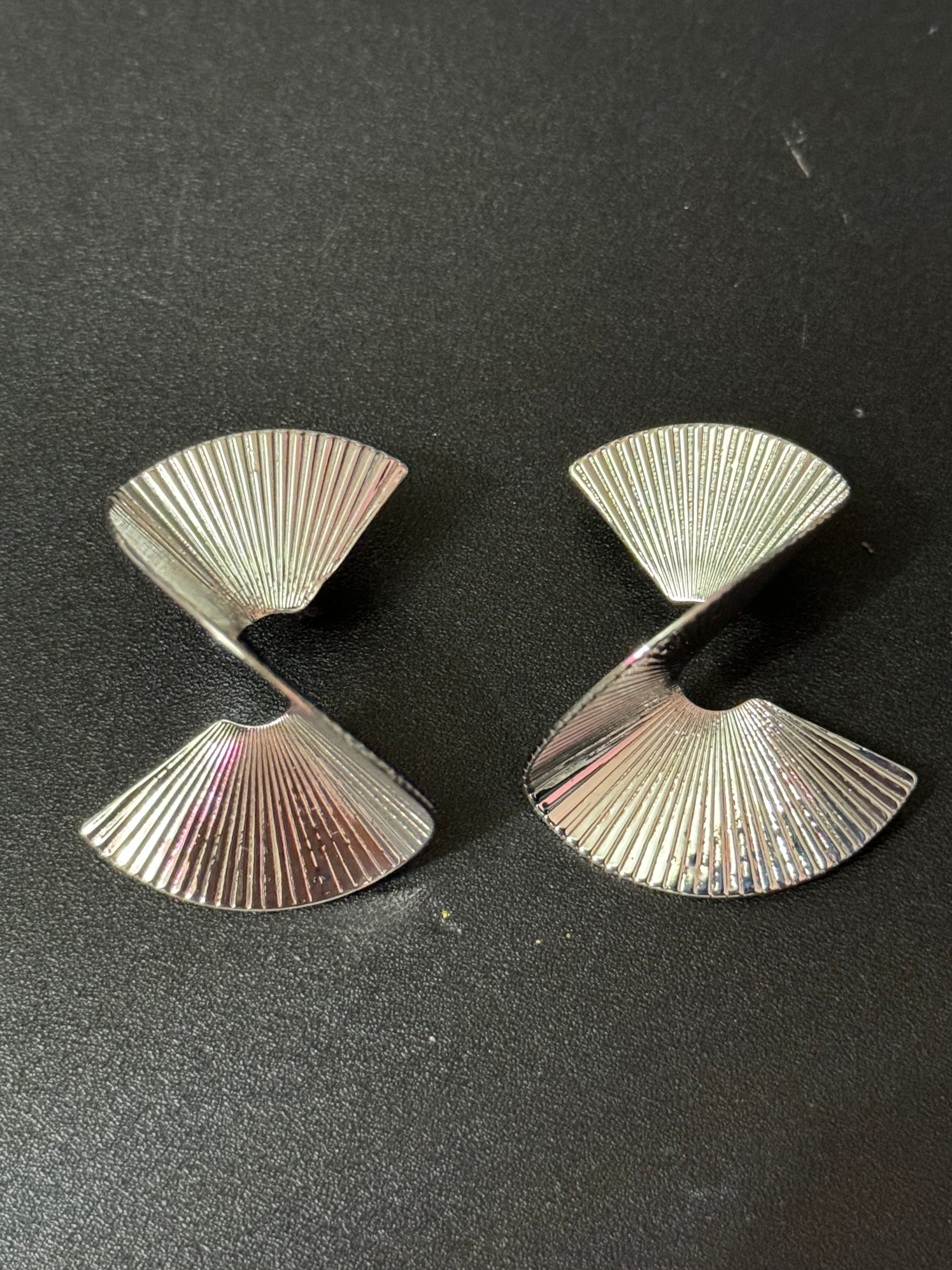 Oversized twisted abstract fan earrings silver tone