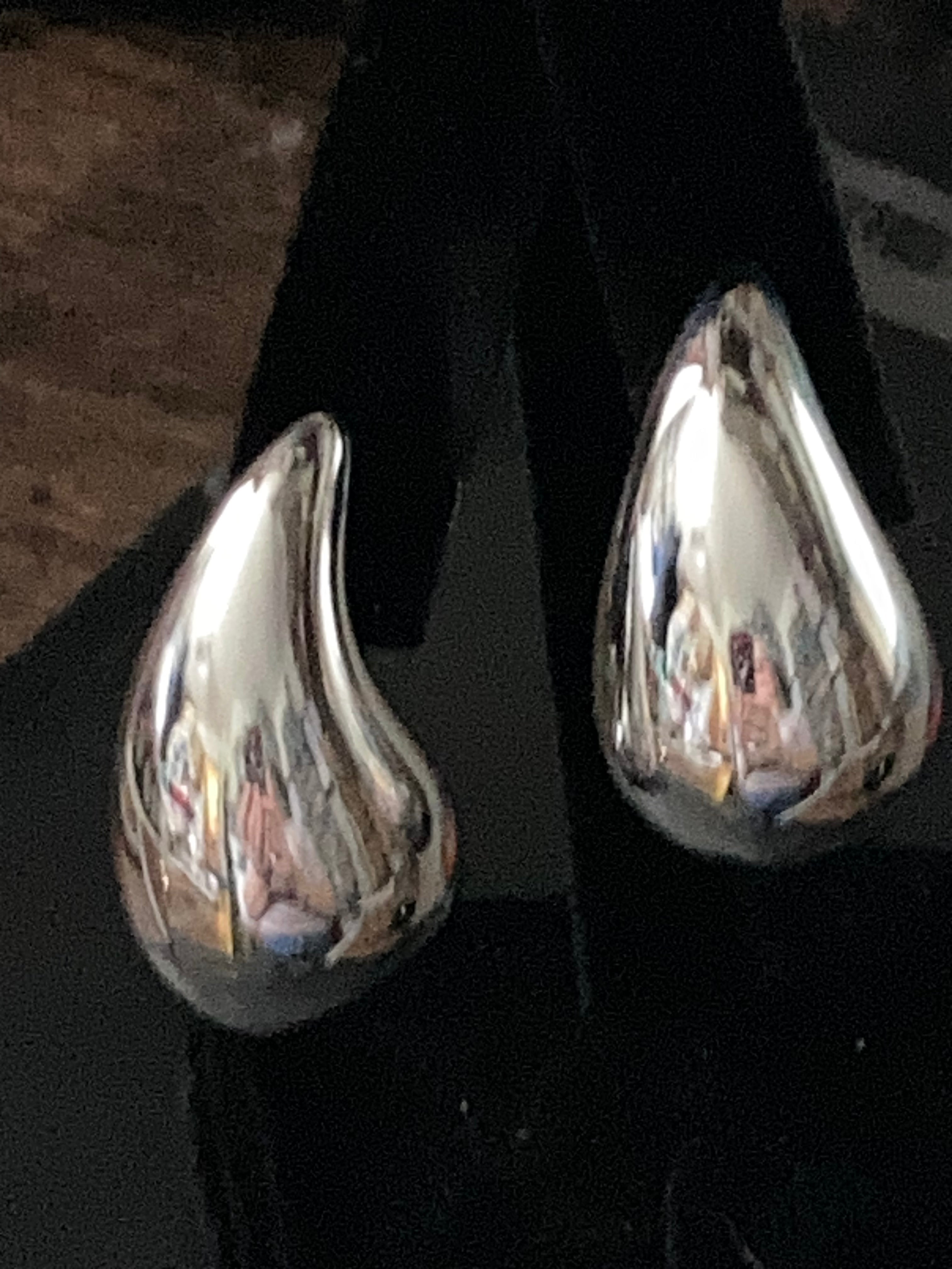 Silver tone oversized high sheen dome earrings comma  teardrop shaped