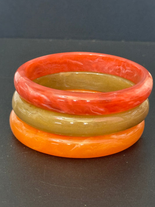 orange red brown autumnal stack of plastic bangles