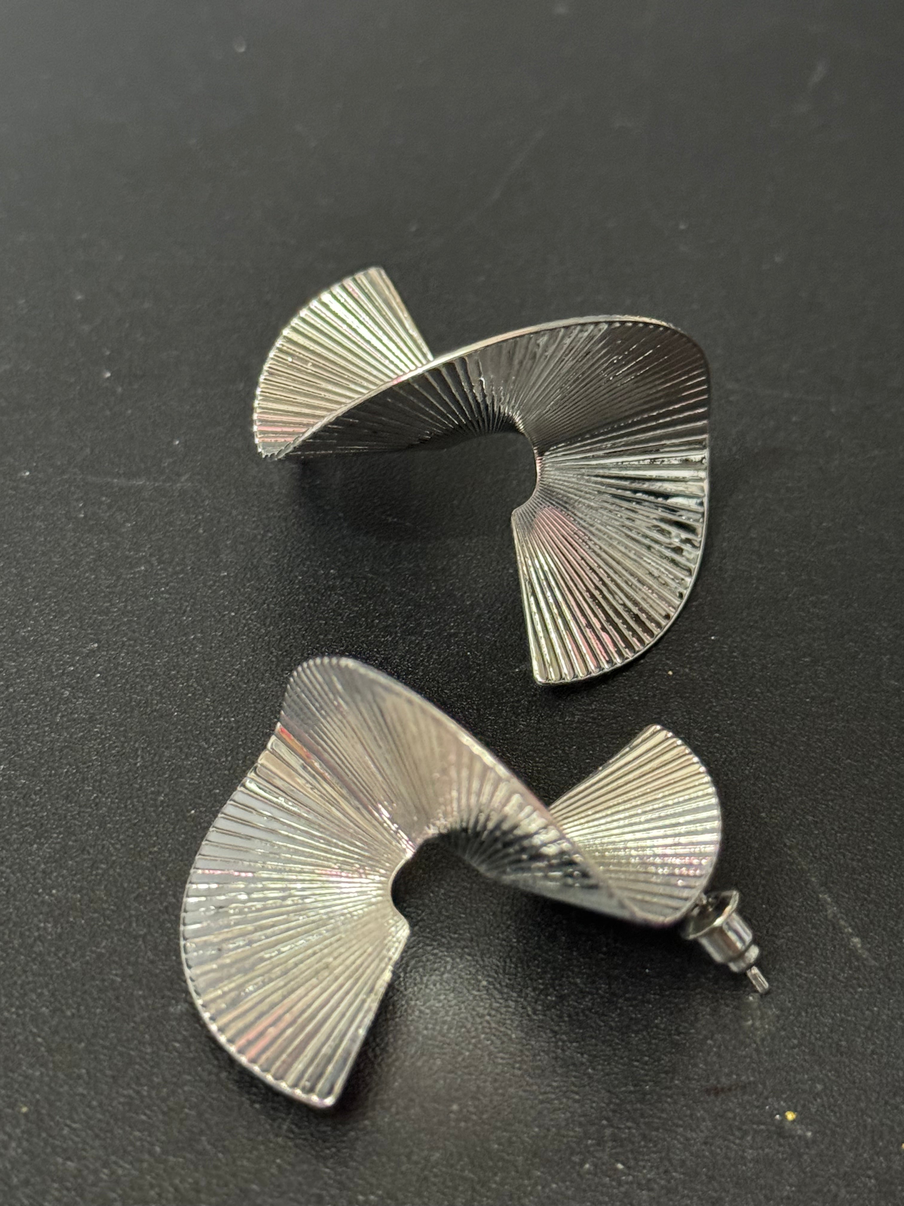 Oversized twisted abstract fan earrings silver tone