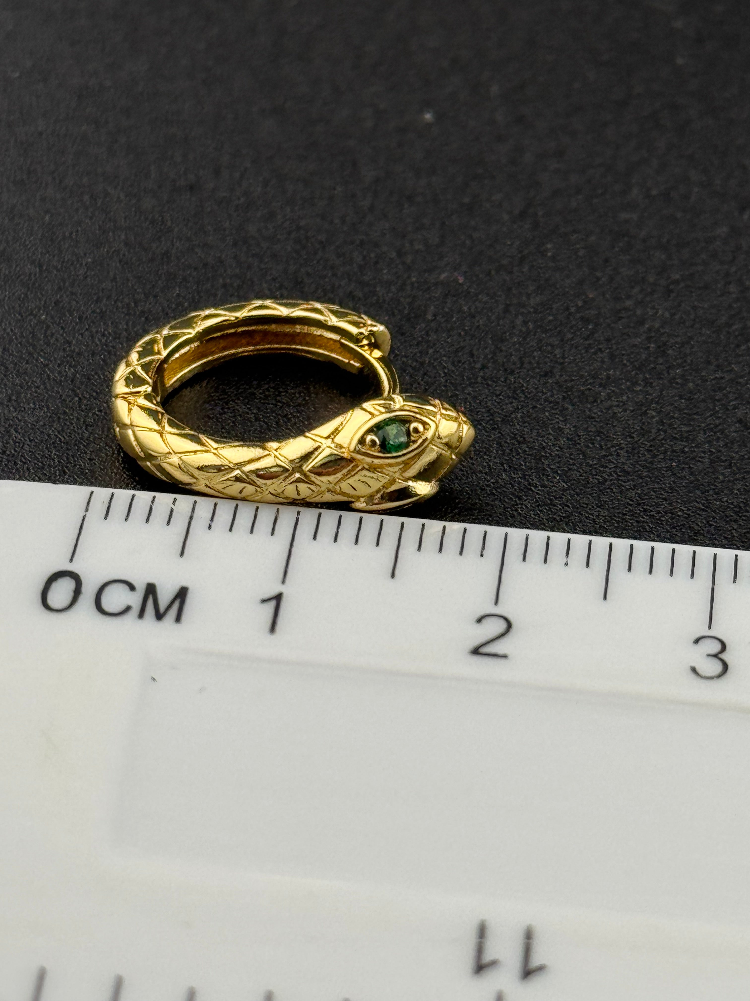 Small gold tone snake hoop earrings with CZ emerald eyes