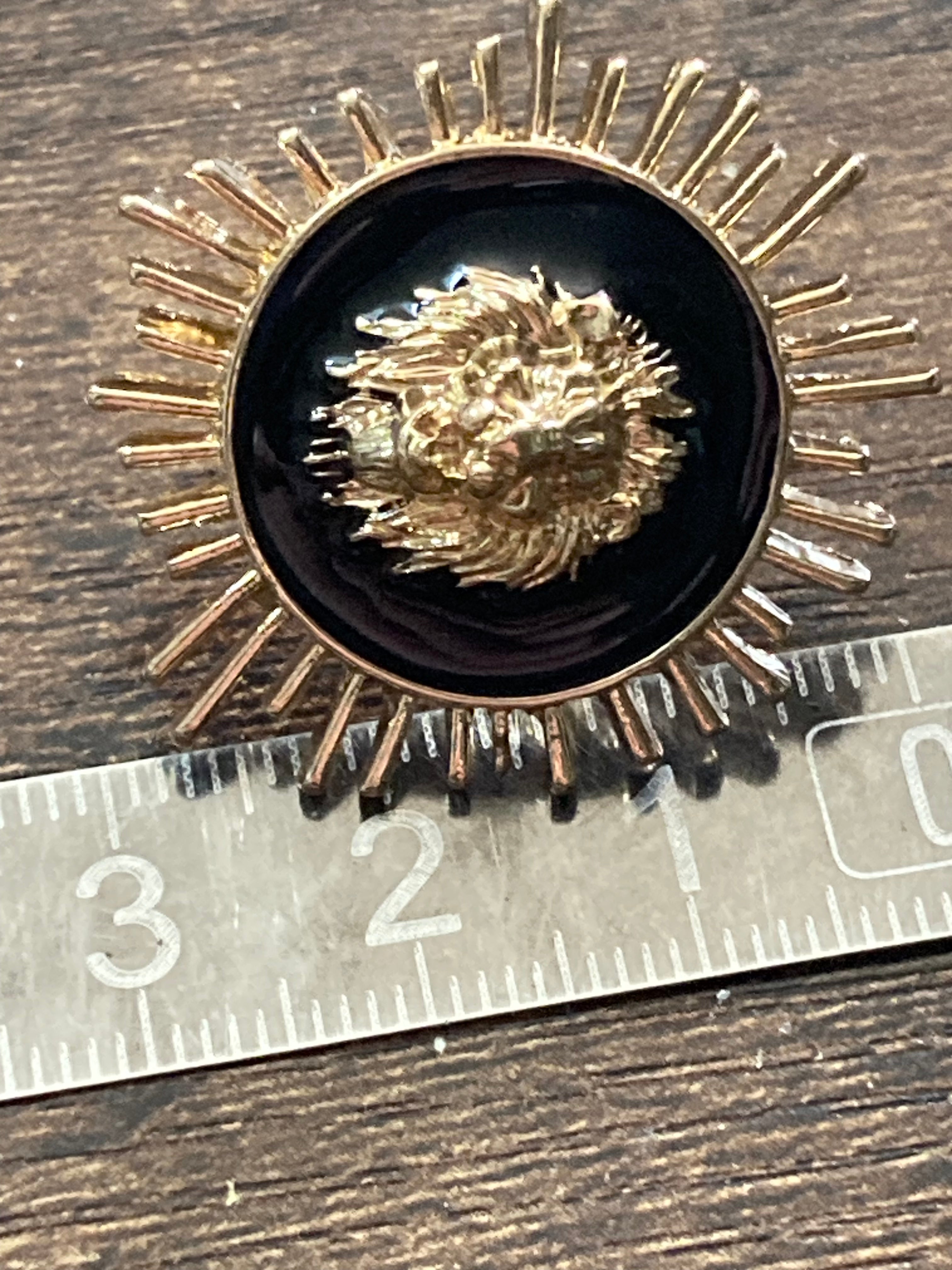 Oversized black and gold lions head spiky stud earrings pierced