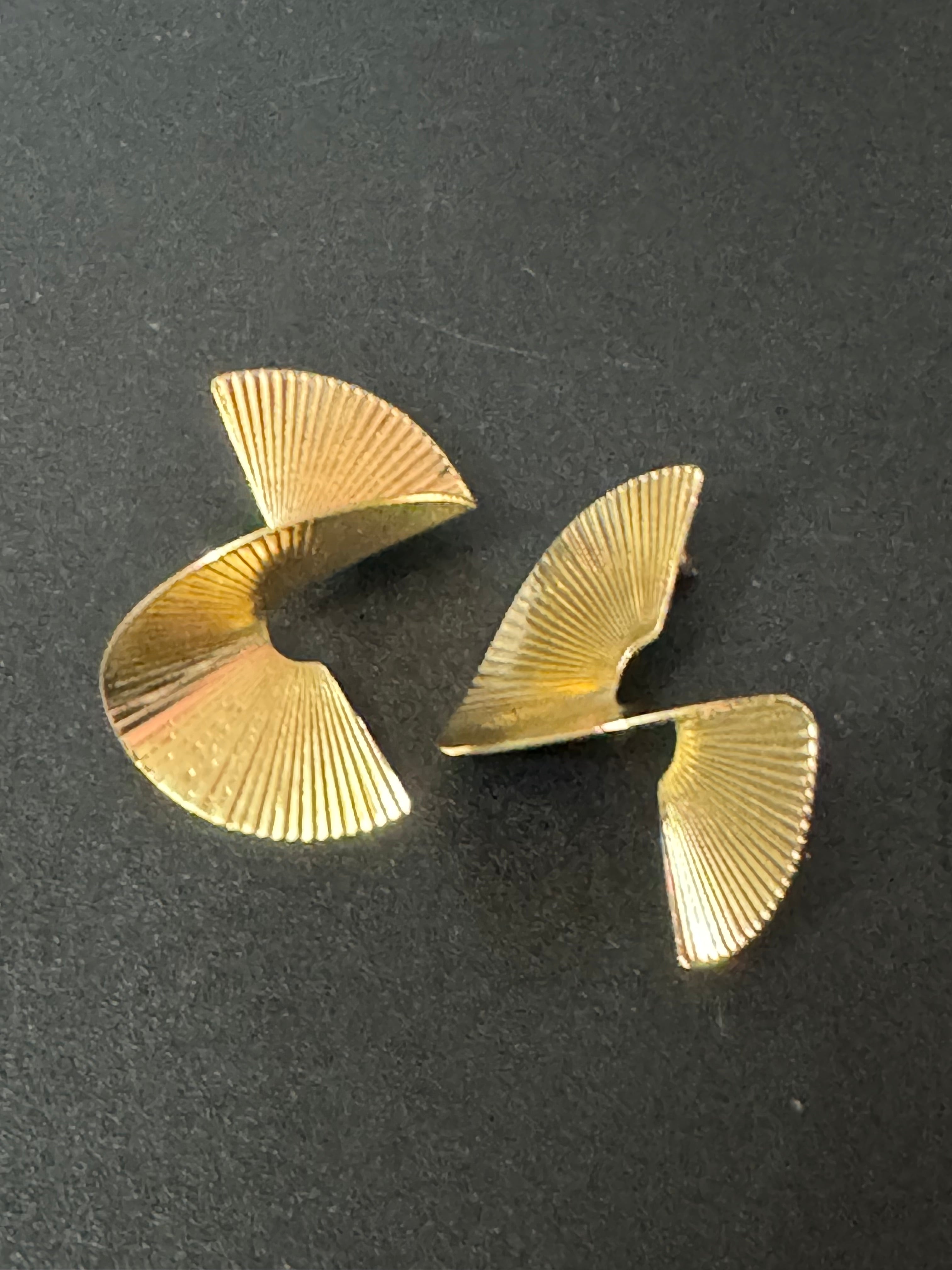 Oversized twisted abstract fan earrings gold tone