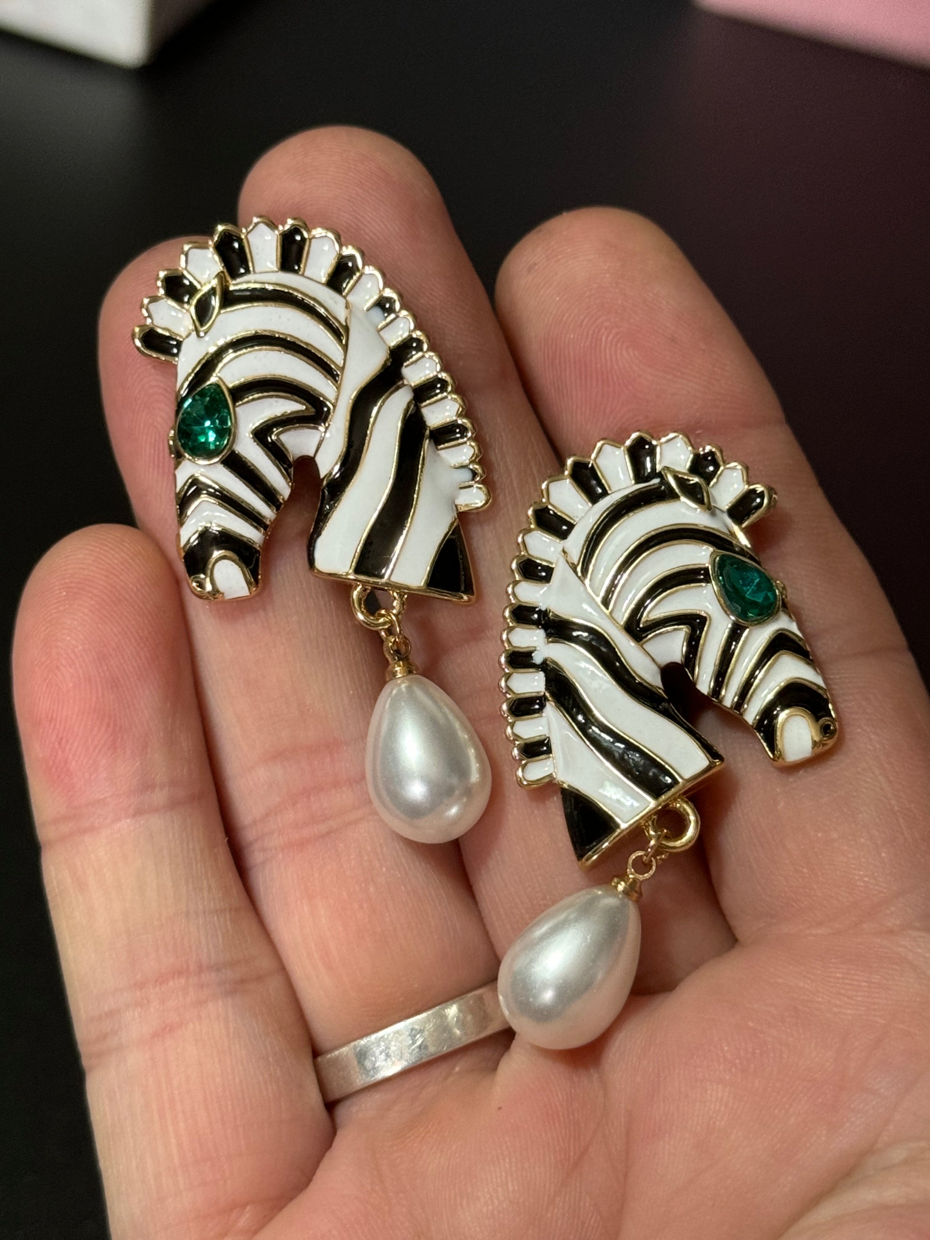 Gold tone zebra pearl drop earrings