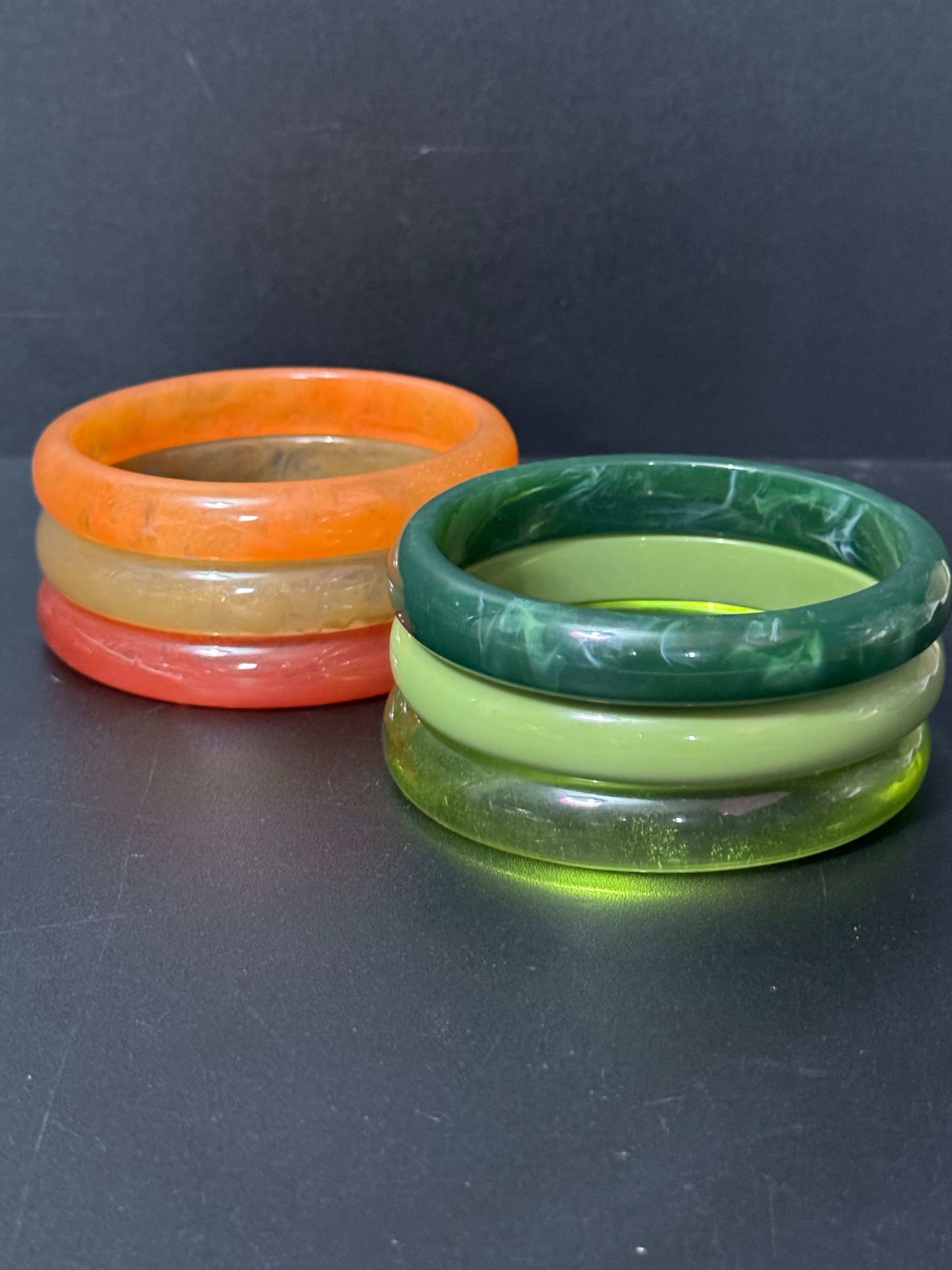 A trio of either orange or green tones mix and match acrylic bangles