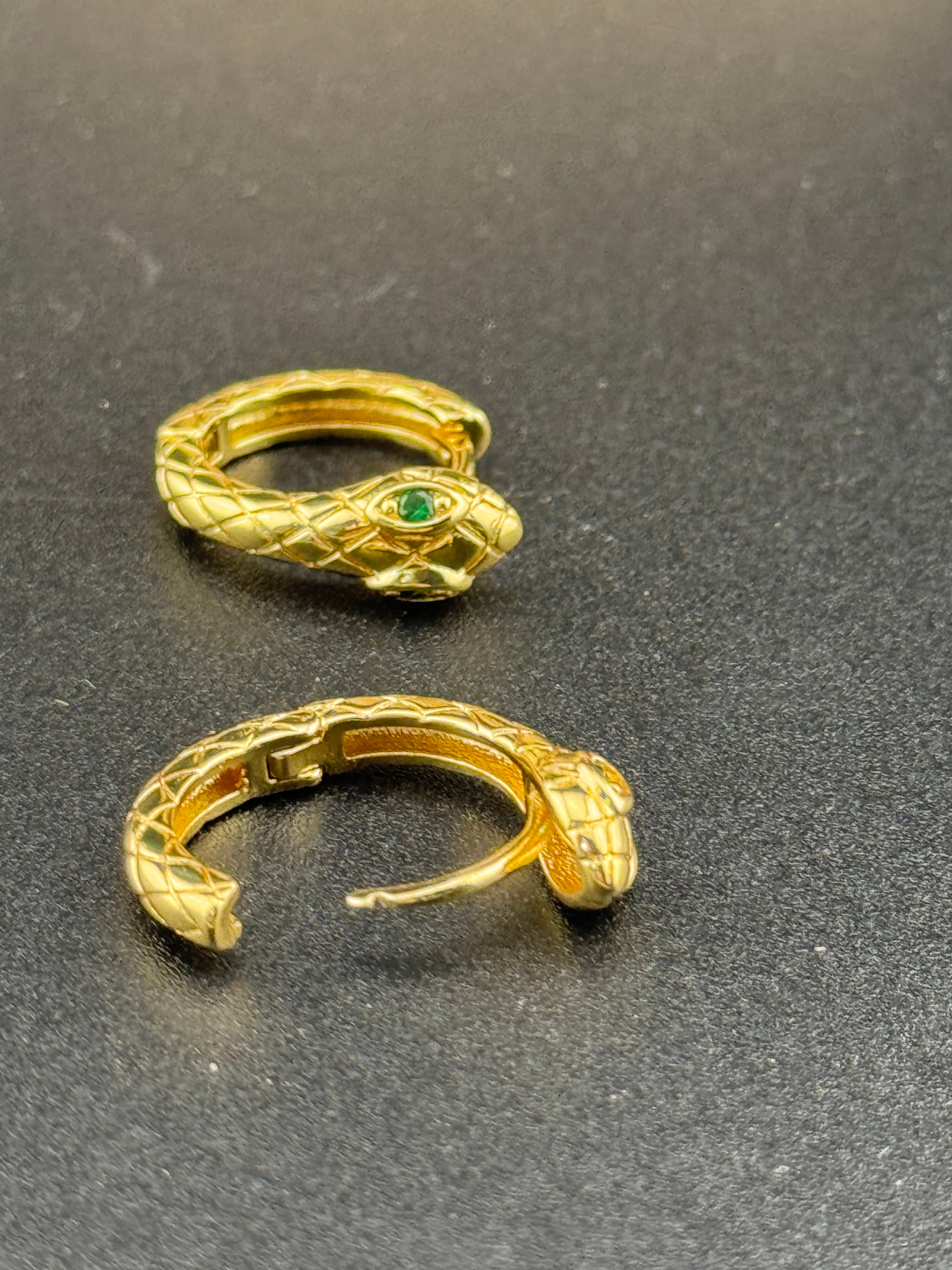 Small gold tone snake hoop earrings with CZ emerald eyes