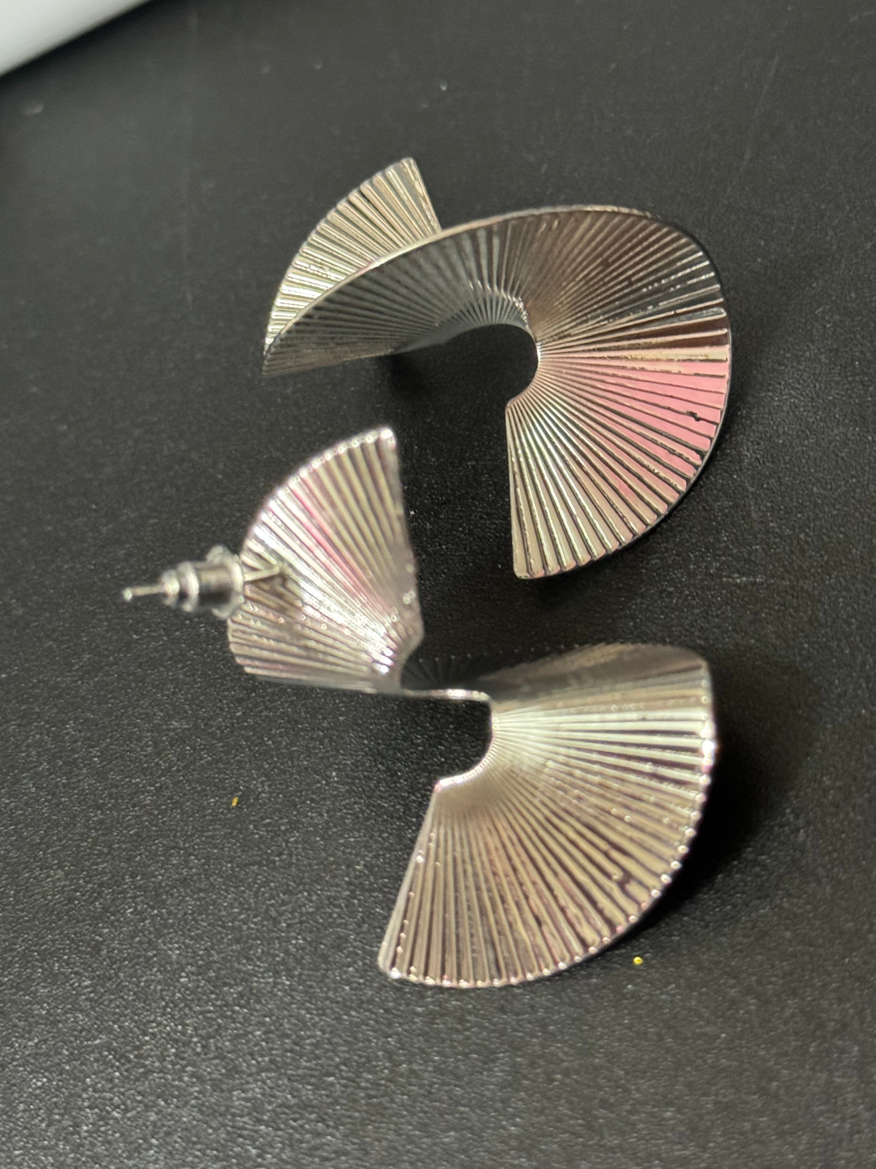 Oversized twisted abstract fan earrings silver tone