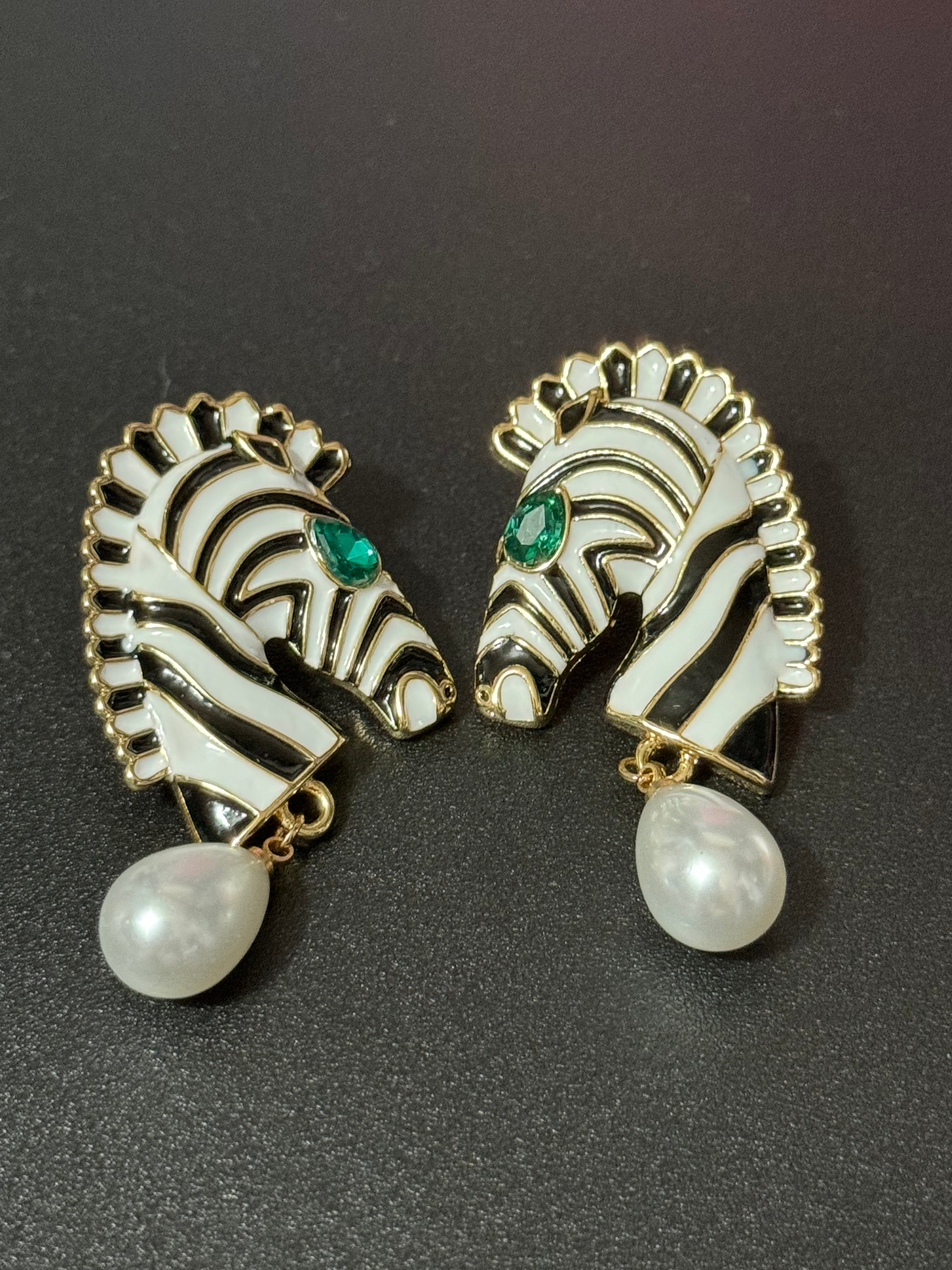 Gold tone zebra pearl drop earrings