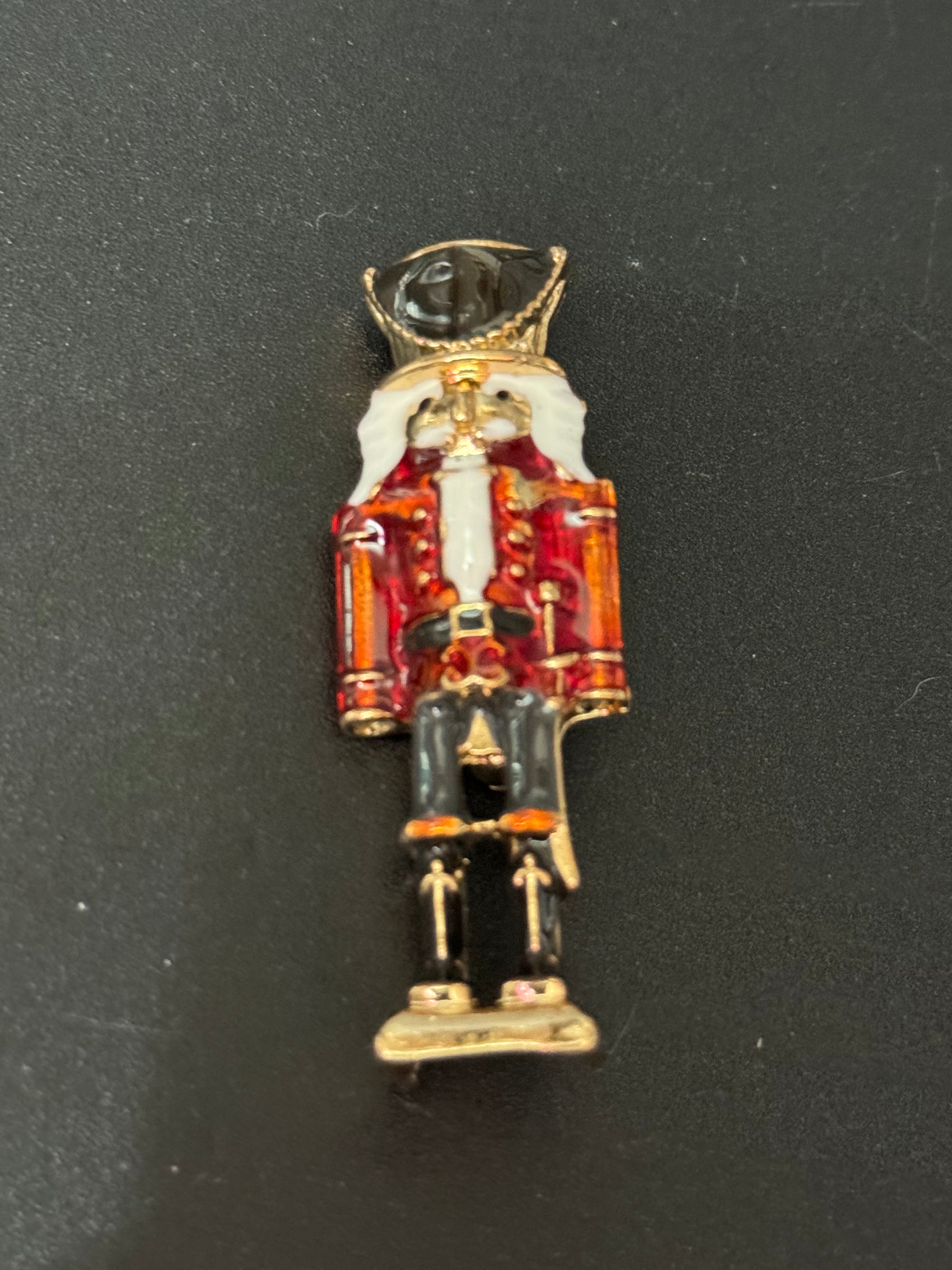 Nutcracker man soldier red and black enamel Christmas brooch