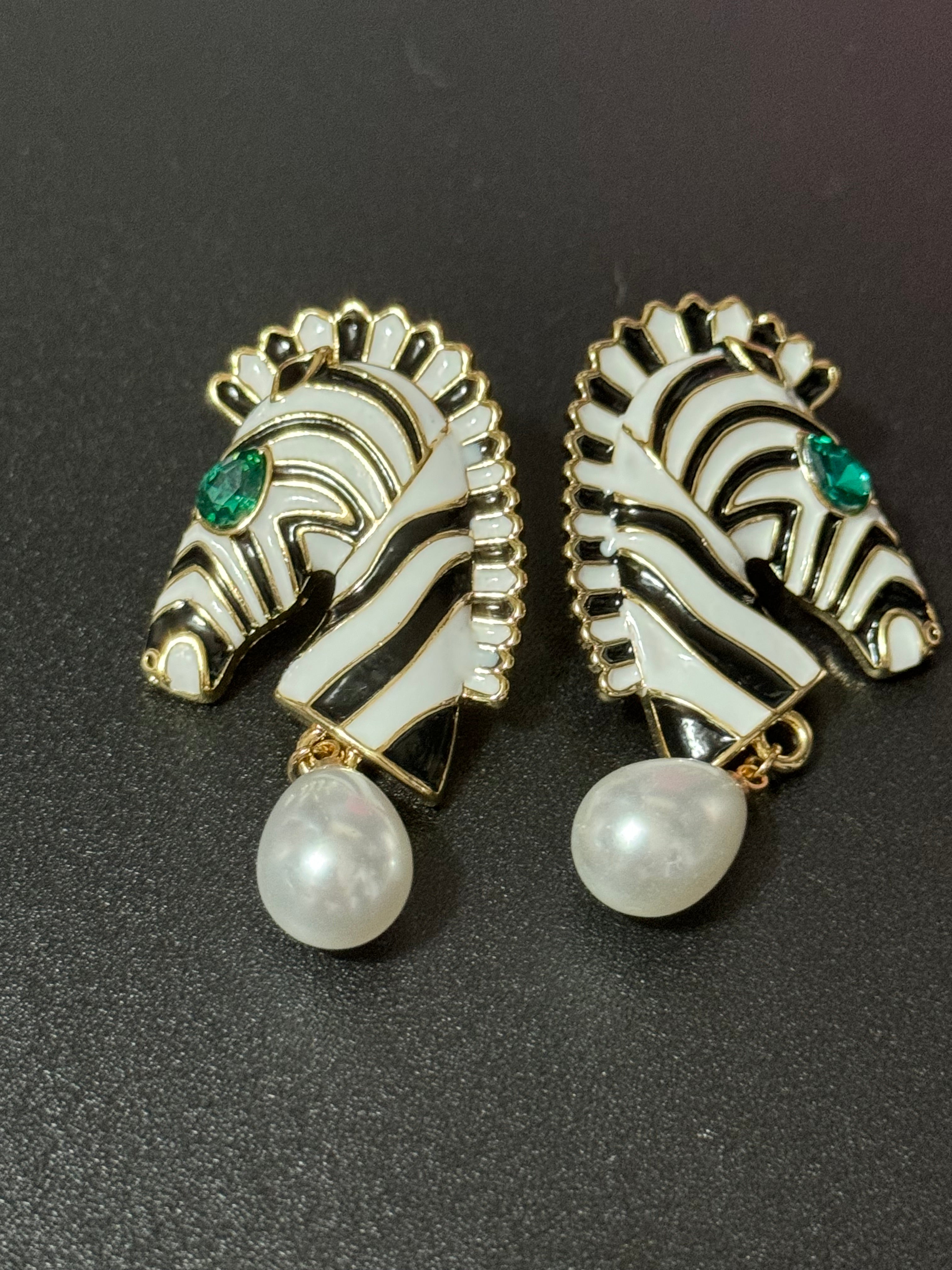 Gold tone zebra pearl drop earrings