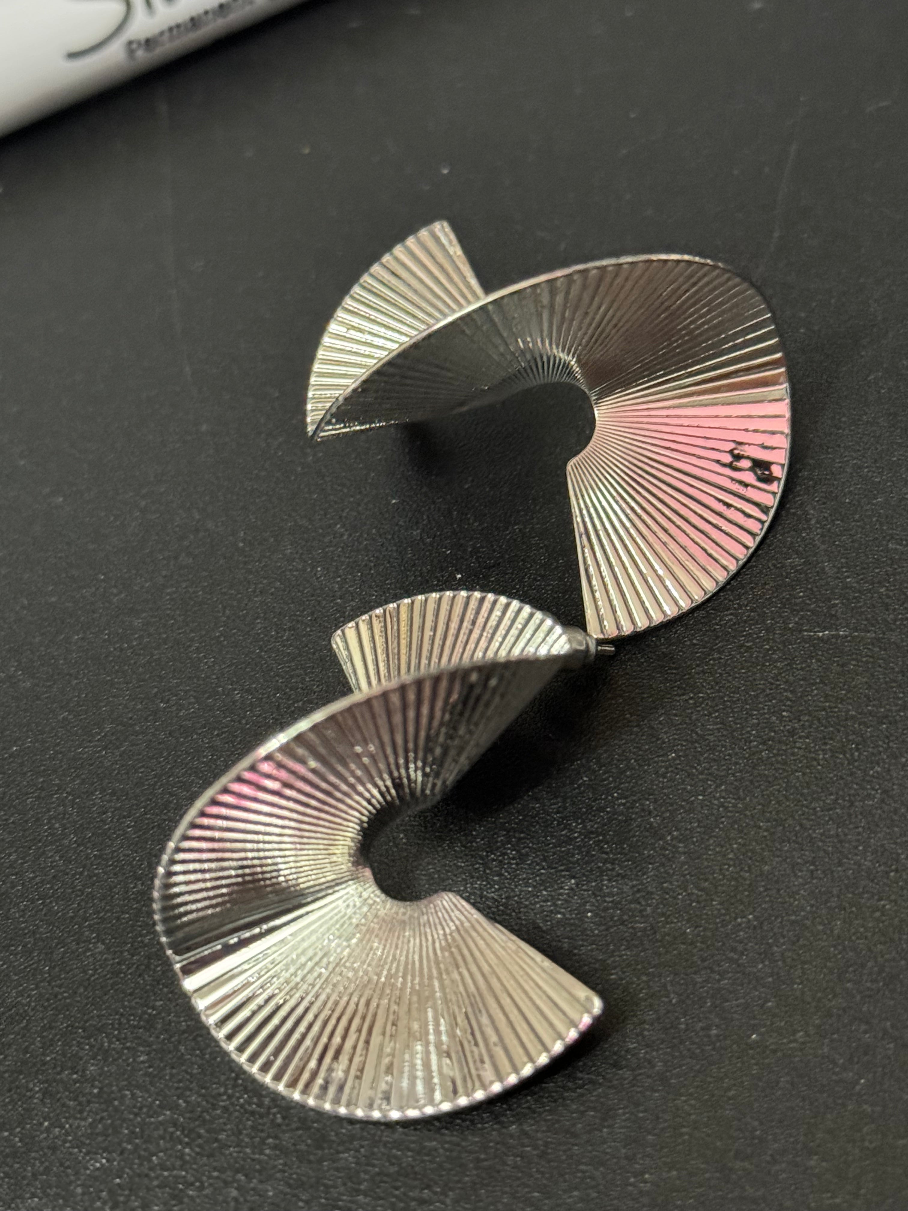 Oversized twisted abstract fan earrings silver tone