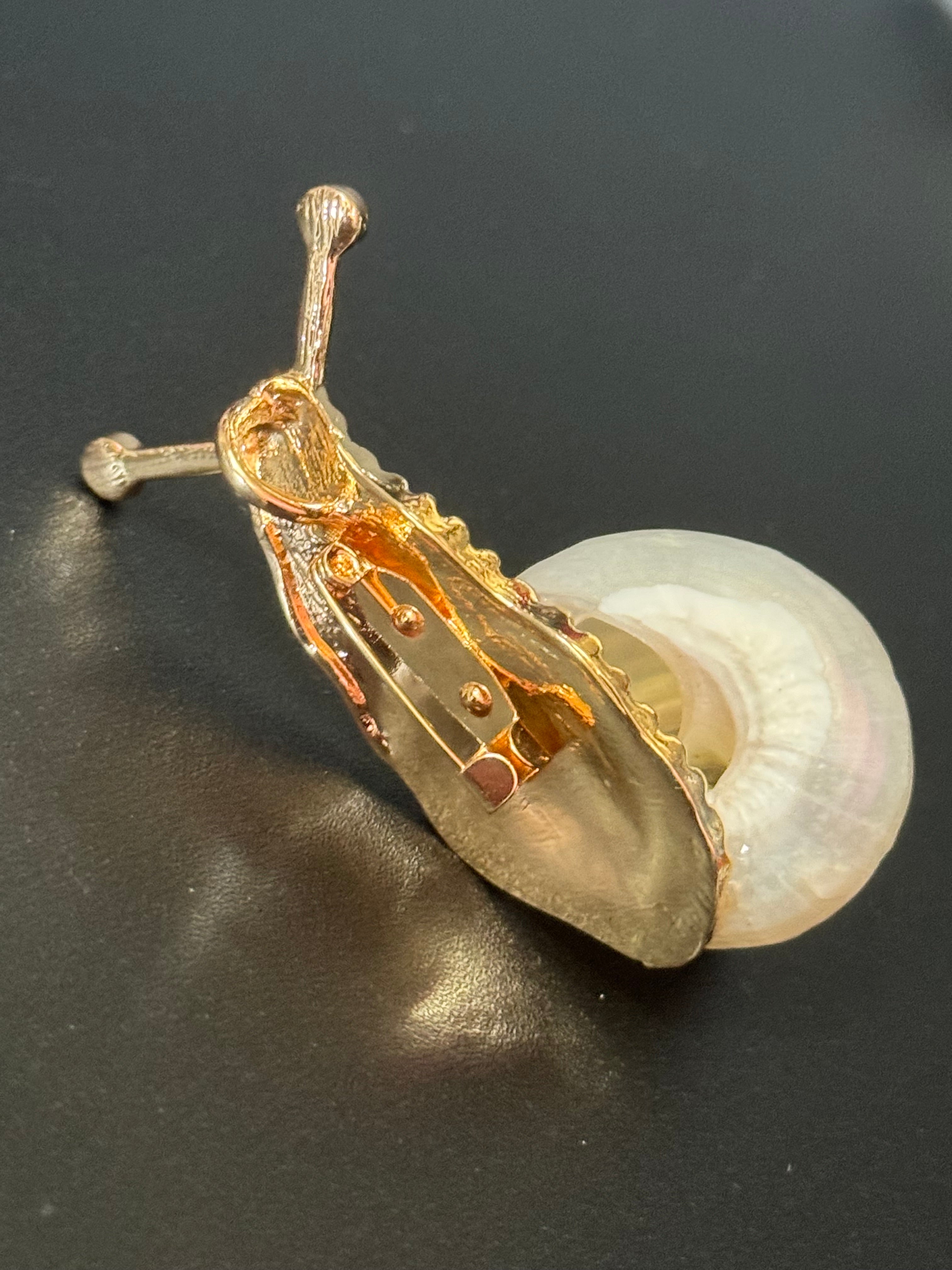 White seashell gold tone snail brooch