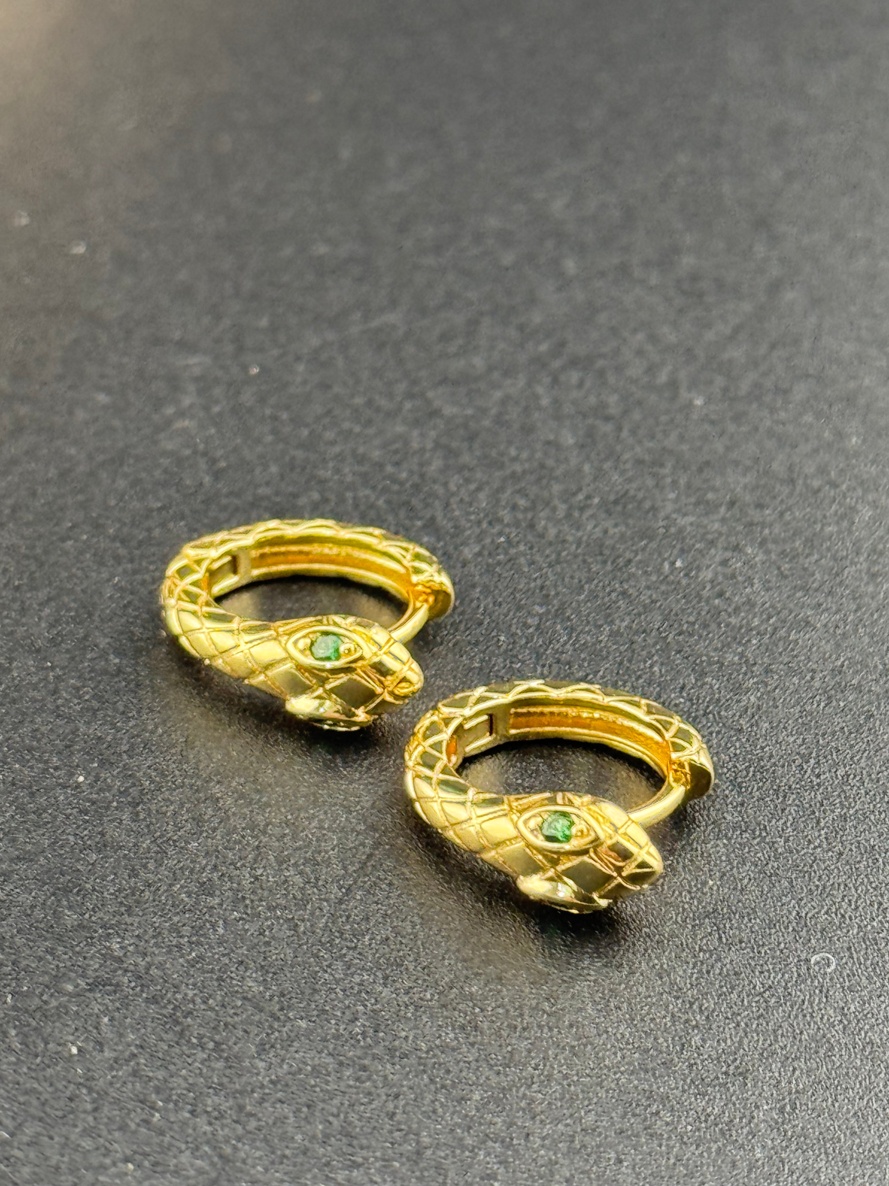 Small gold tone snake hoop earrings with CZ emerald eyes