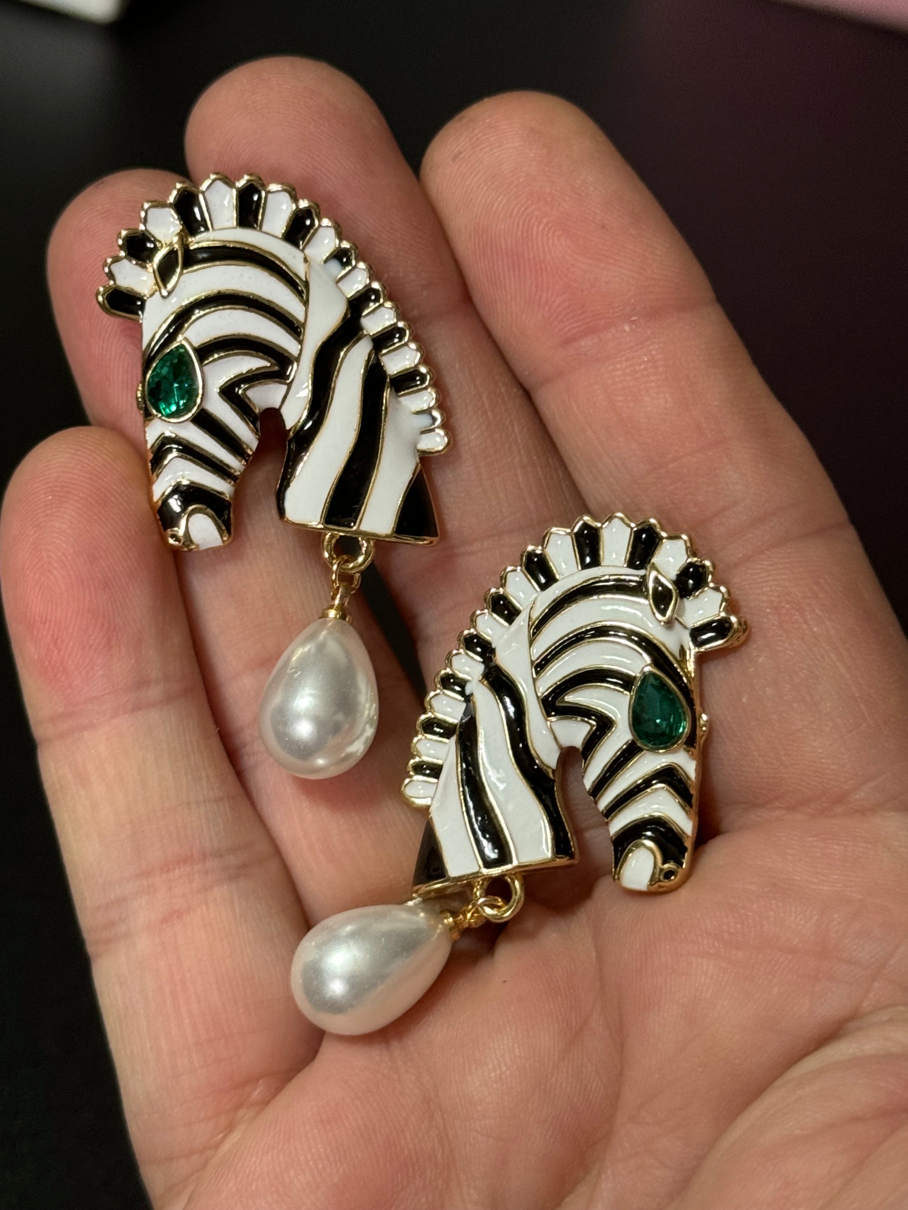 Gold tone zebra pearl drop earrings