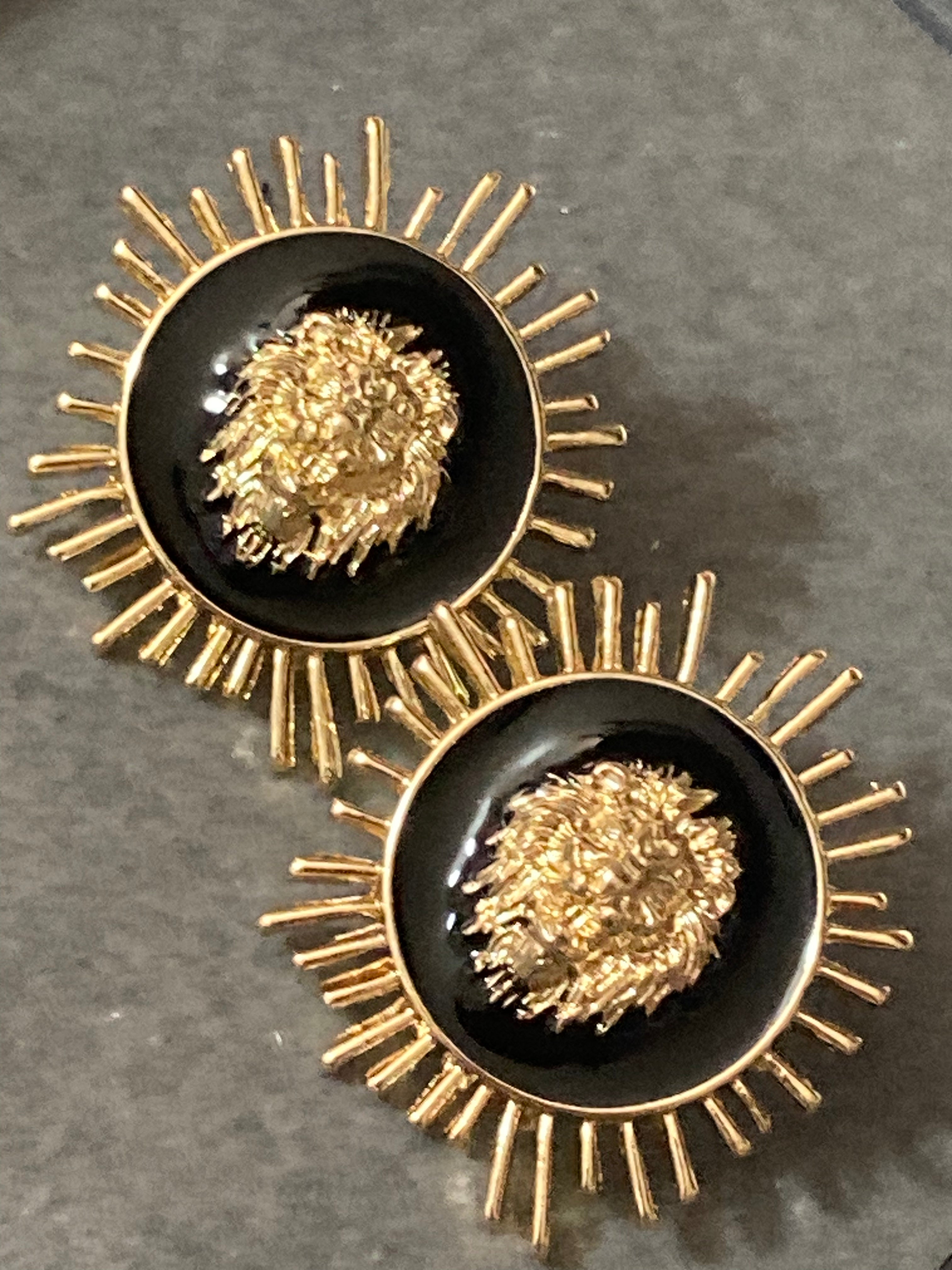 Oversized black and gold lions head spiky stud earrings pierced