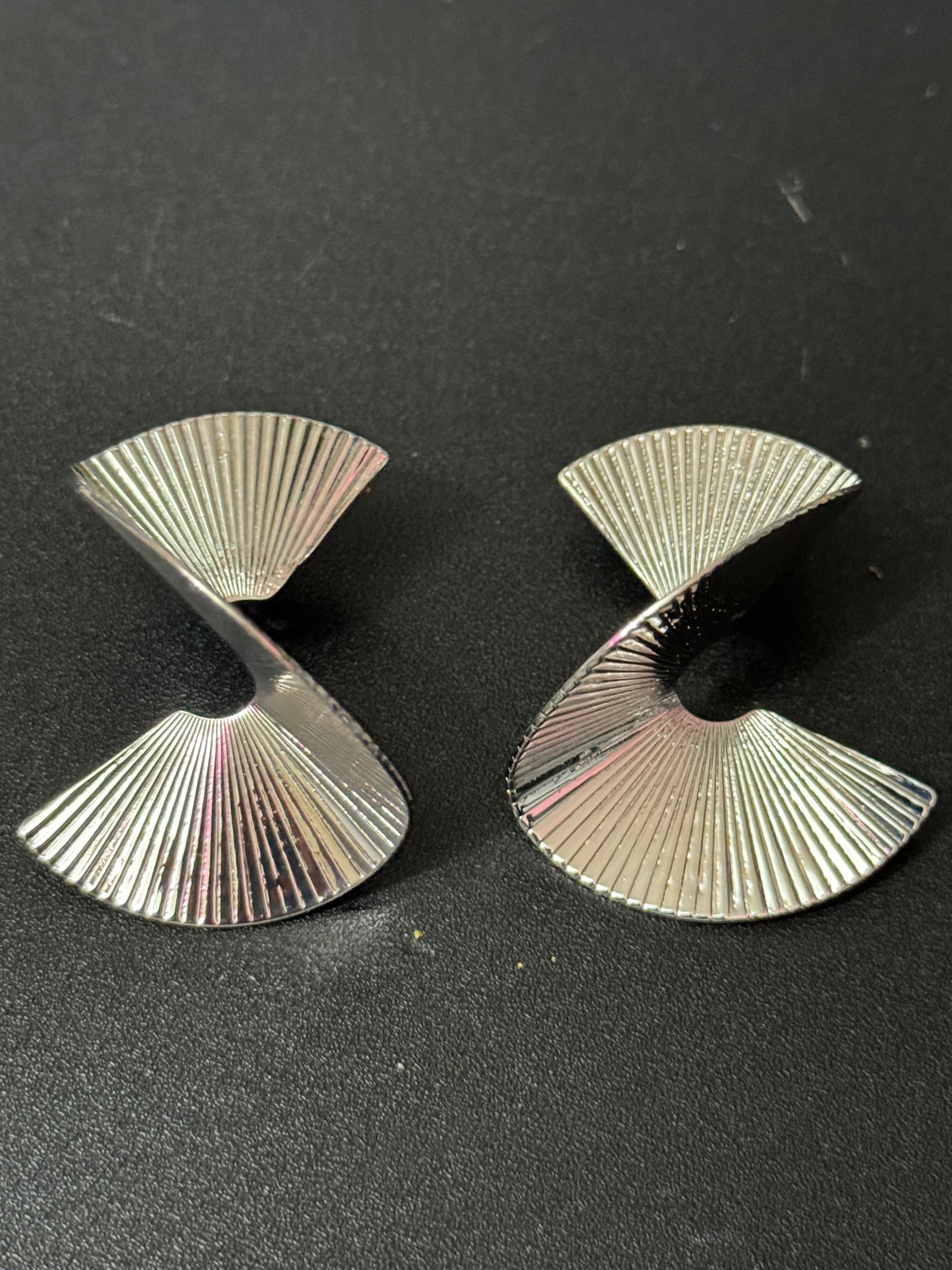 Oversized twisted abstract fan earrings silver tone