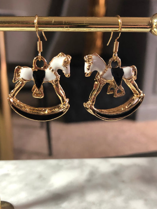 white & black enamel gold tone rocking horse earrings