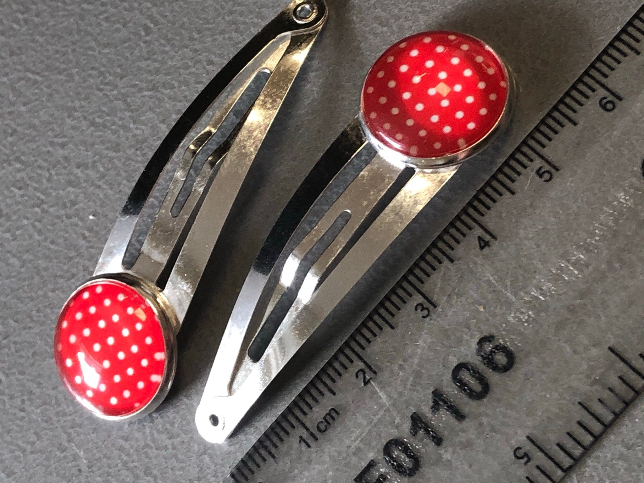 pair of red & white polka dot hair clips silver tone snap lock closure