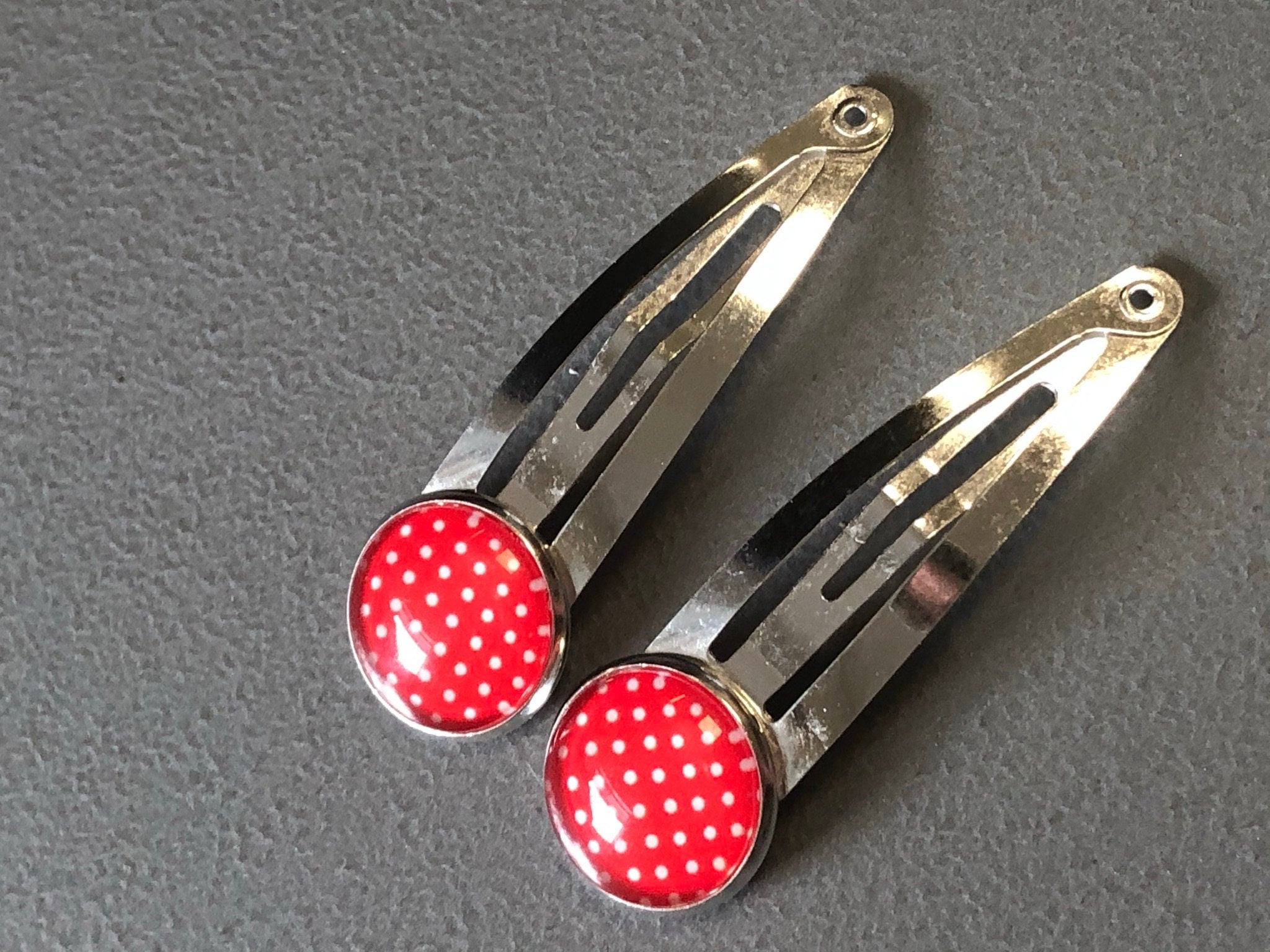 pair of red & white polka dot hair clips silver tone snap lock closure