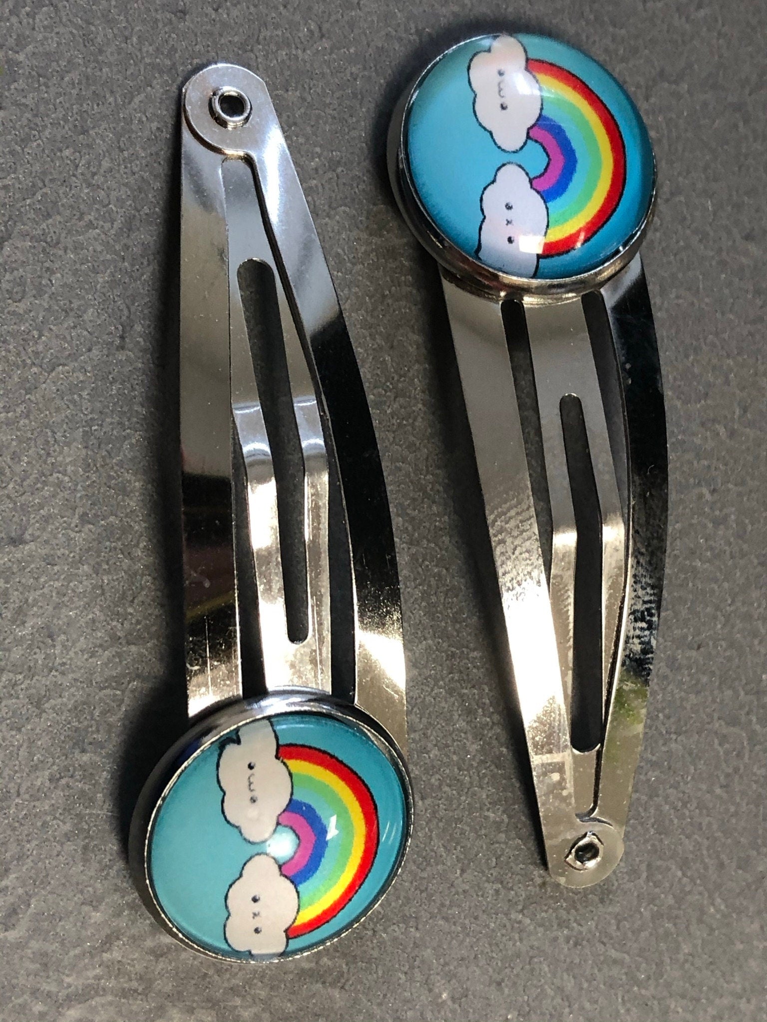 pair of girls rainbow hair clips silver tone snap lock closure