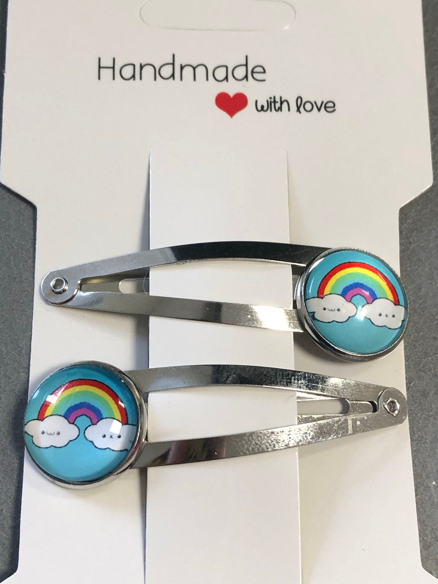 pair of girls rainbow hair clips silver tone snap lock closure