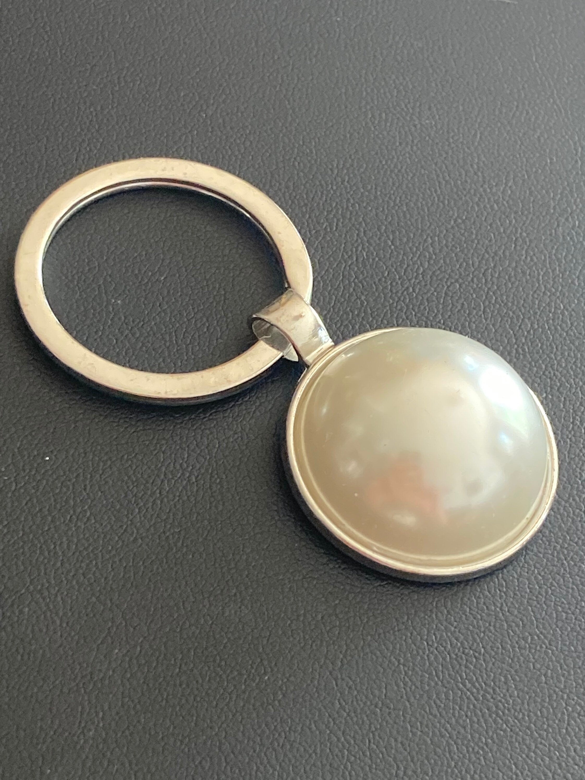 white faux Pearl silver keyring with 25mm plastic domed Pearl cabochon