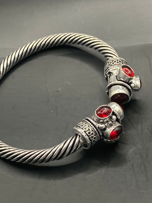 silver tone metal torque cuff bangle bracelet ruby red garnet glass stones