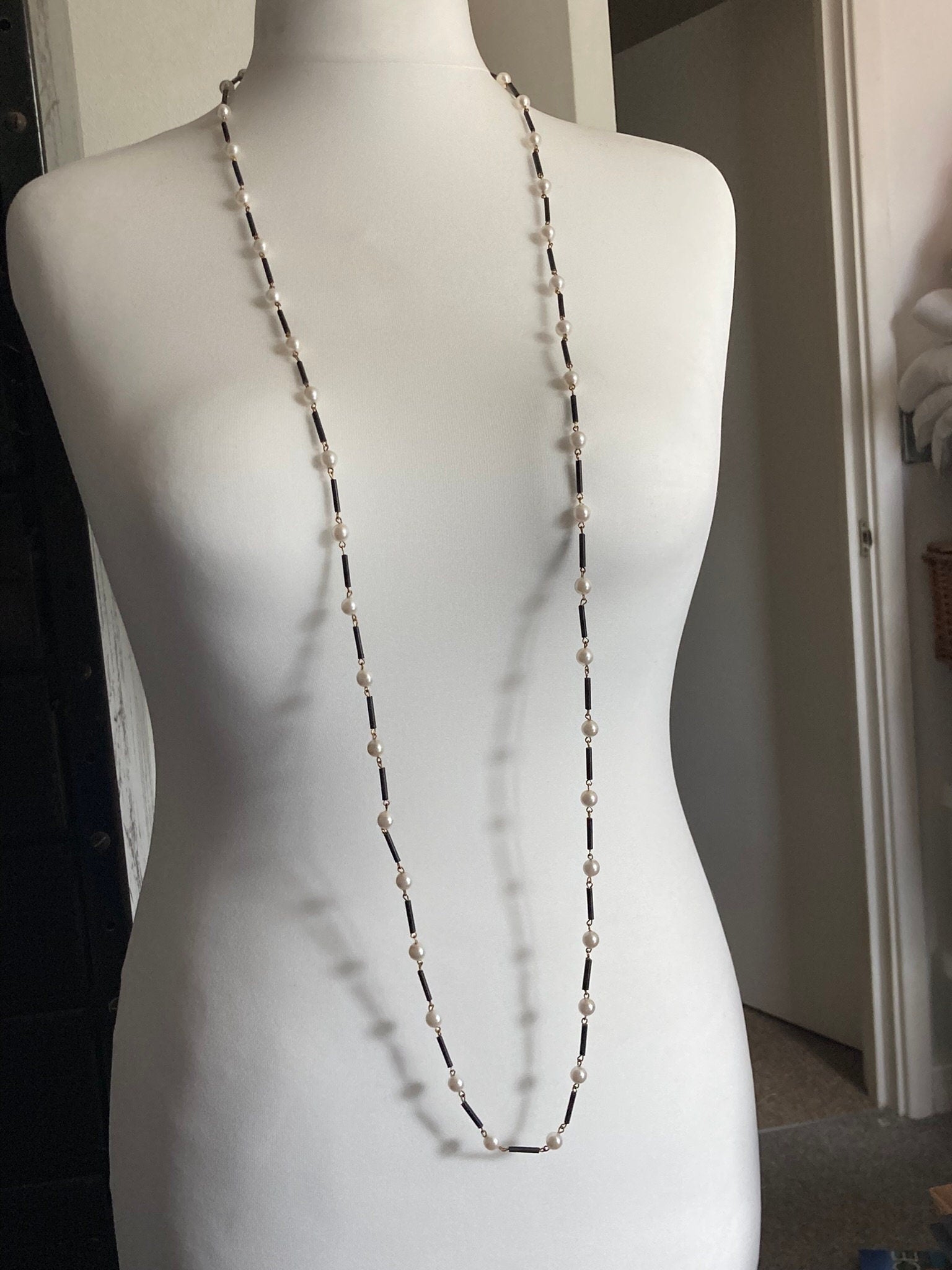 Flapper length MCM cream plastic pearl necklace with black glass bugle beads