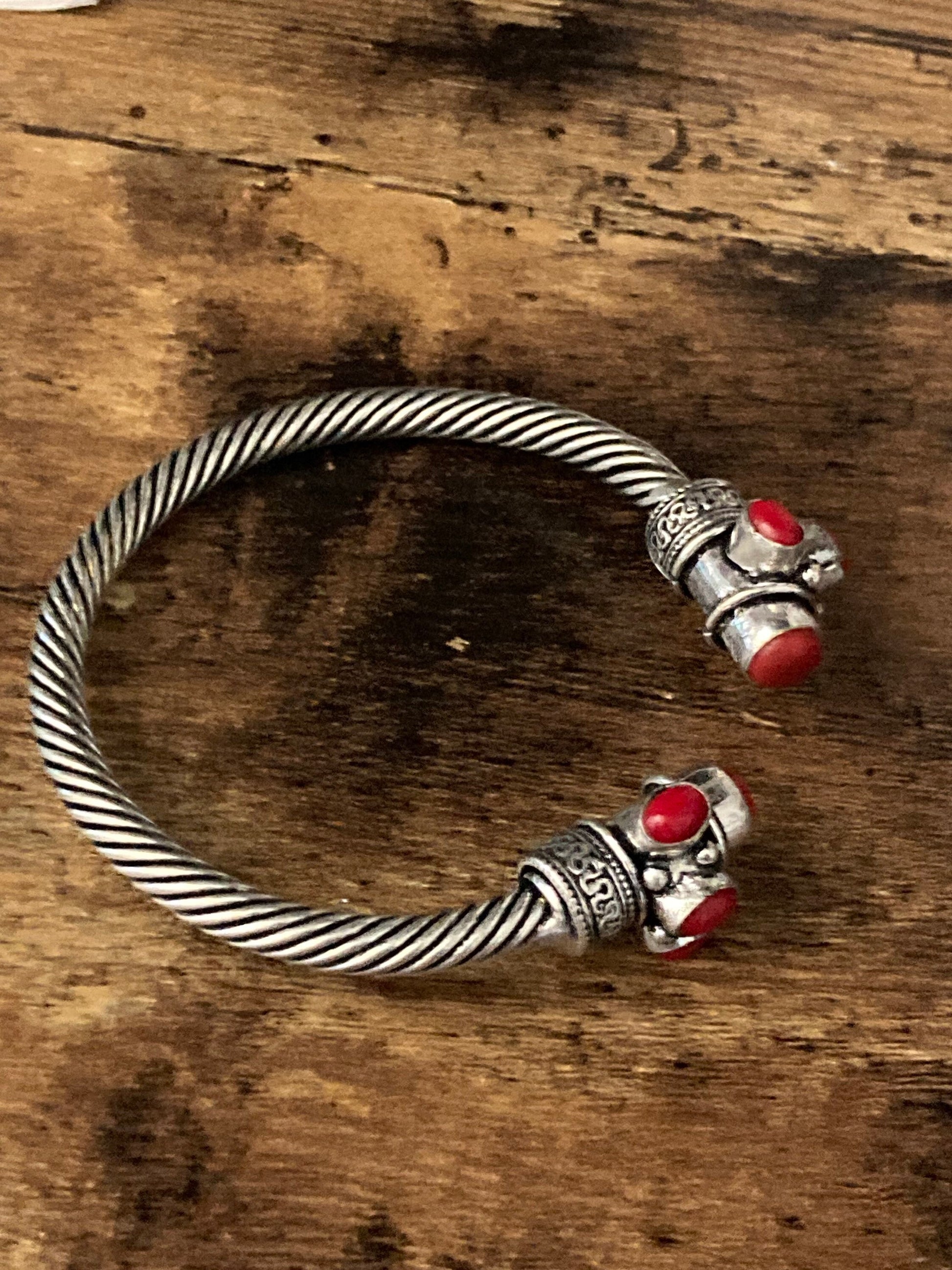 Bright red gemstone silver tone metal torque cuff bangle