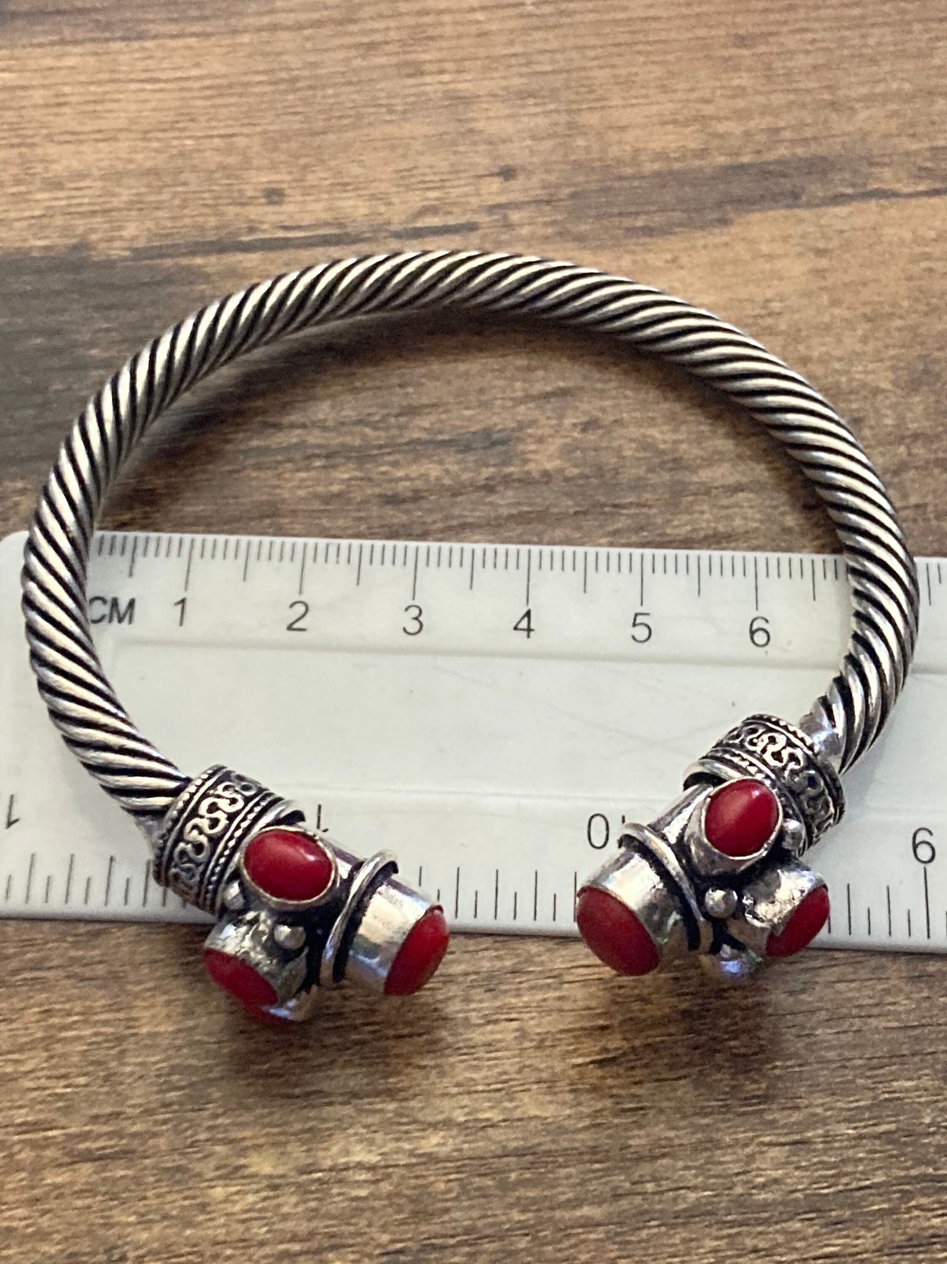 Bright red gemstone silver tone metal torque cuff bangle