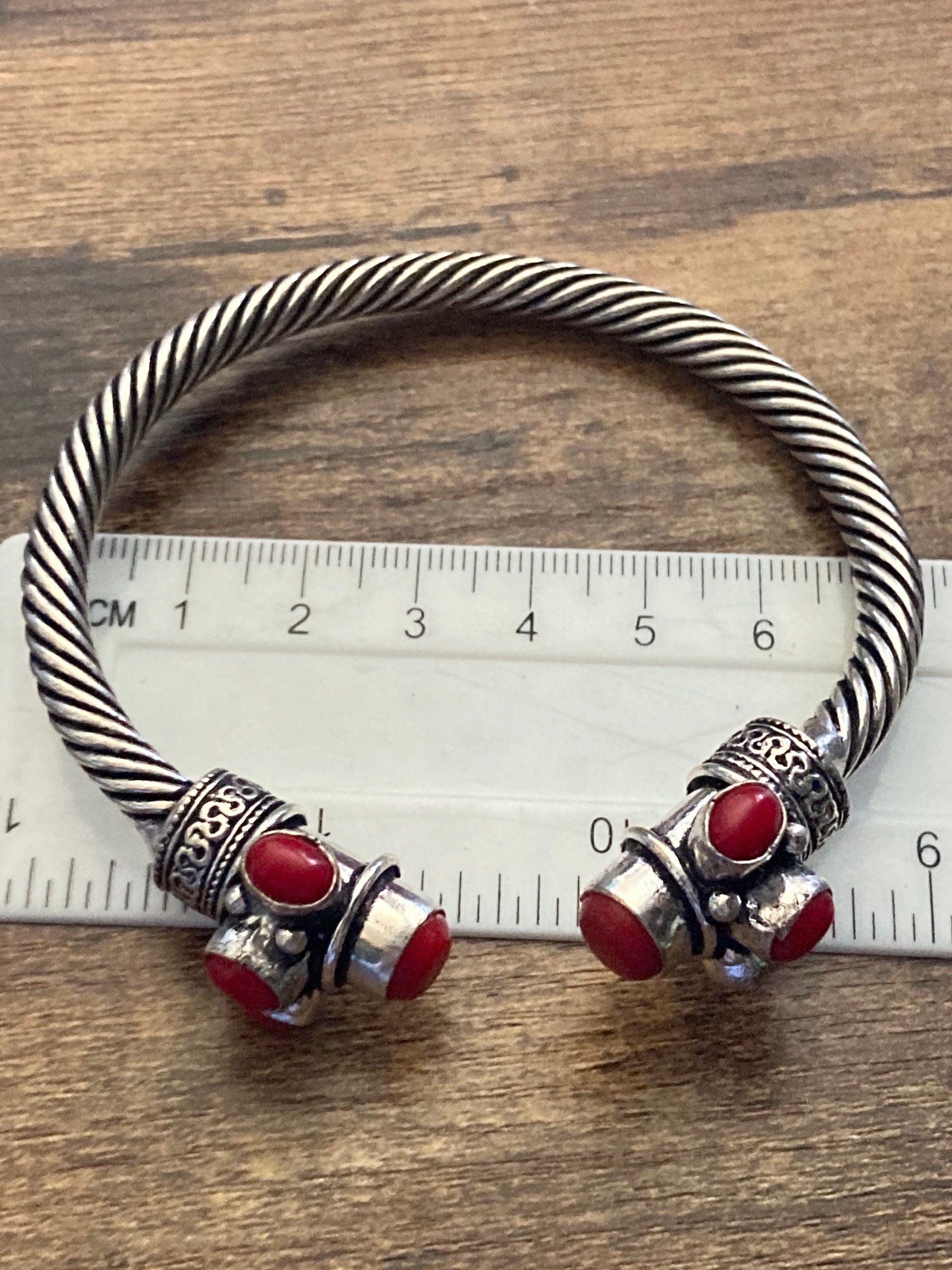 Bright red gemstone silver tone metal torque cuff bangle