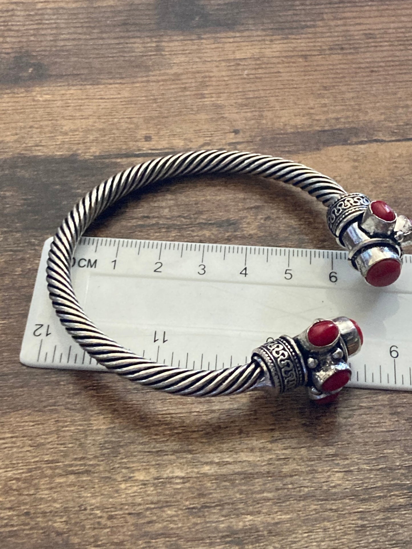 Bright red gemstone silver tone metal torque cuff bangle