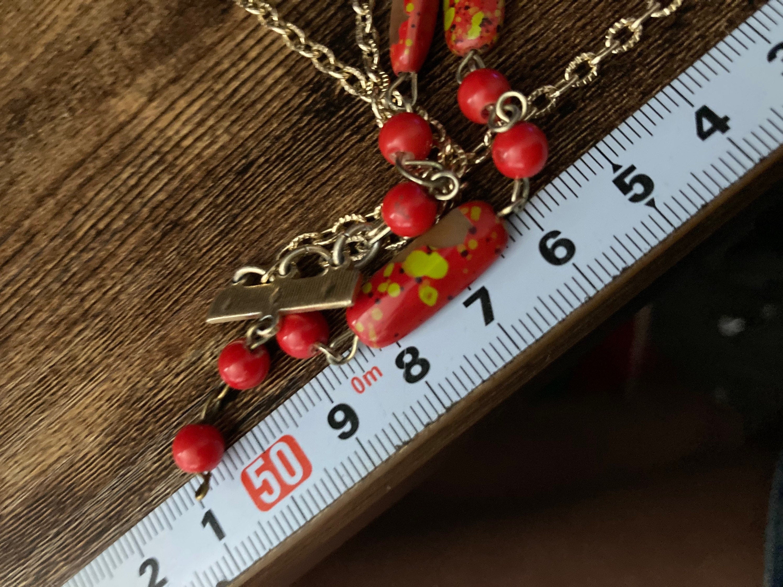 Vintage 1970s gold tone red plastic beaded station link necklace