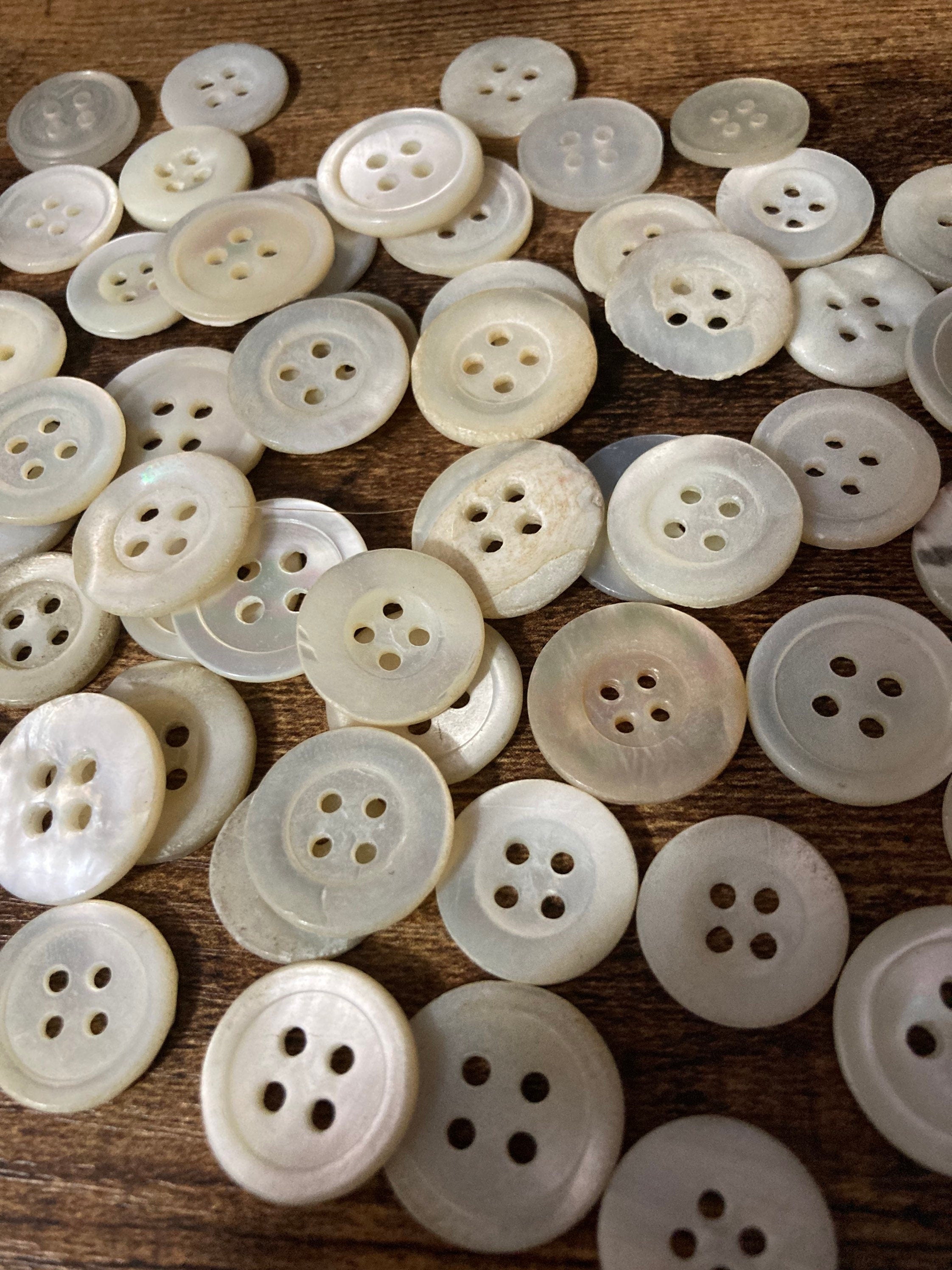 Job lot of 62 true antique vintage mother of Pearl buttons MOP shell medium 4 holes round