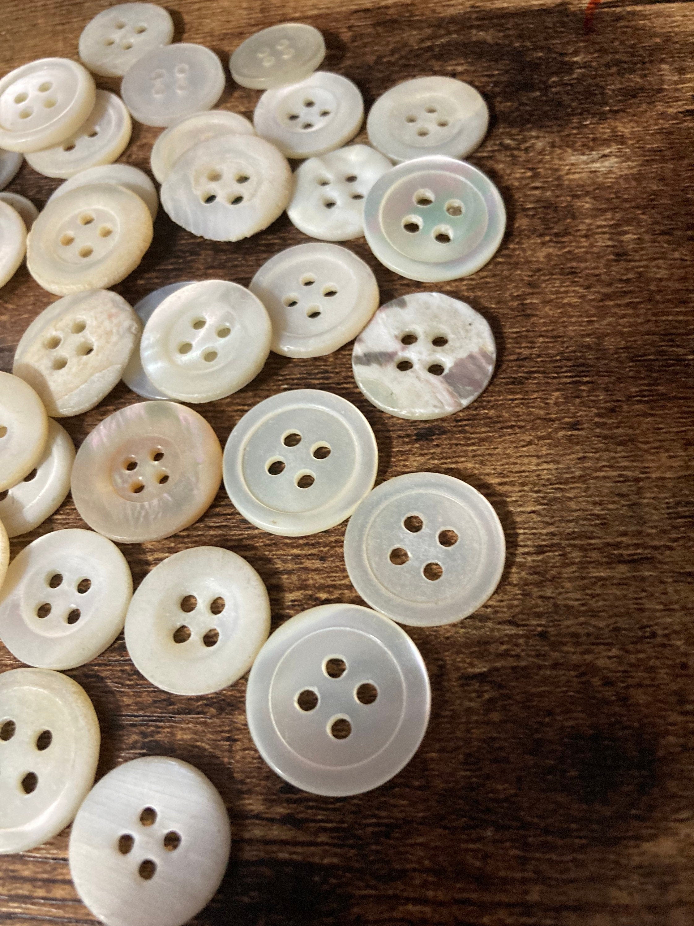 Job lot of 62 true antique vintage mother of Pearl buttons MOP shell medium 4 holes round