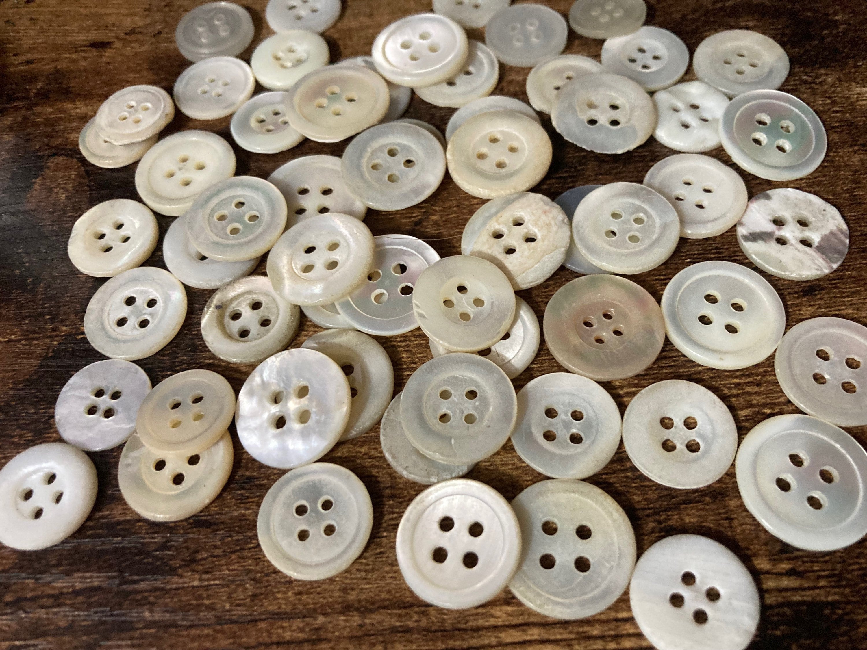 Job lot of 62 true antique vintage mother of Pearl buttons MOP shell medium 4 holes round