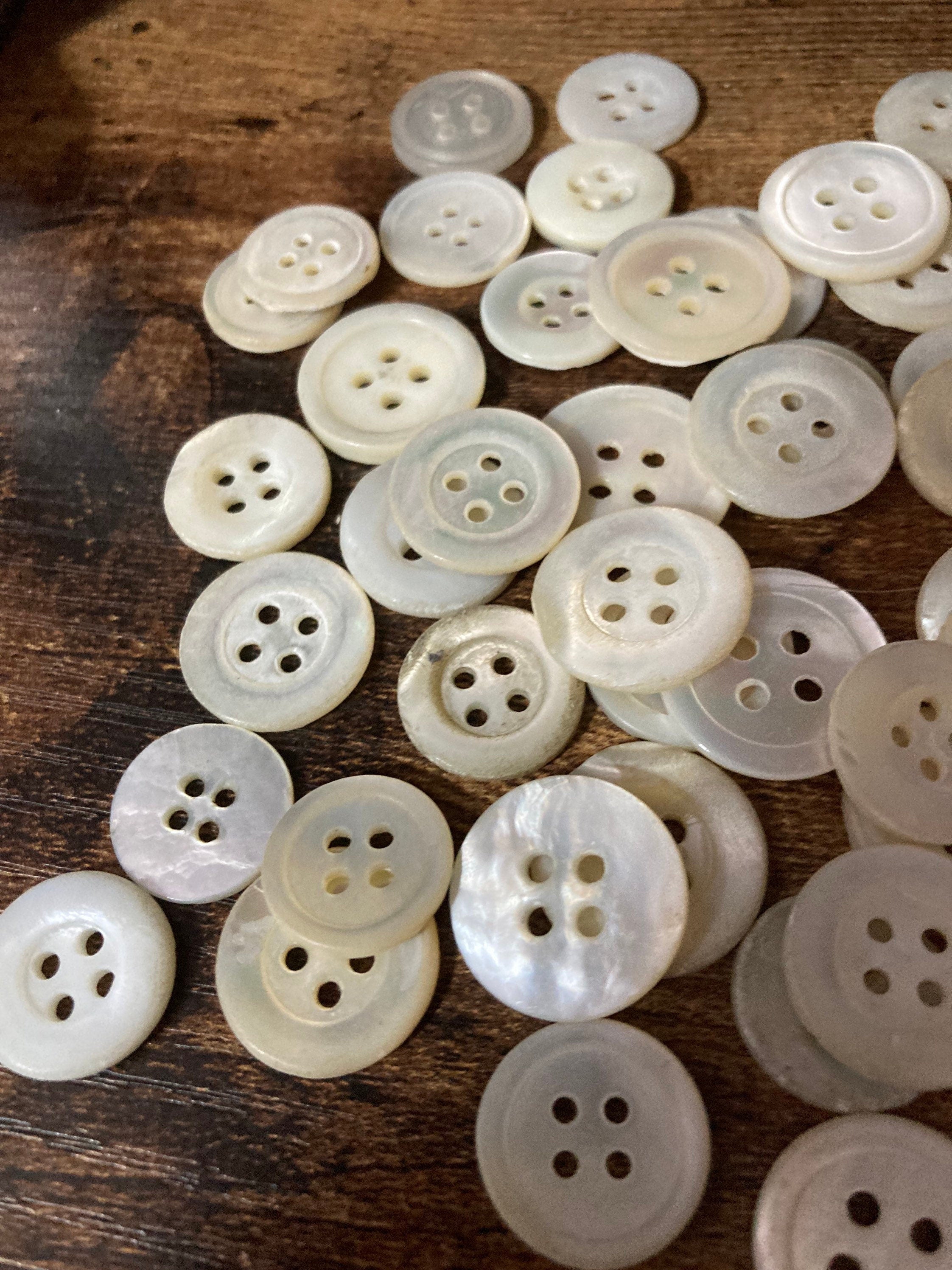 Job lot of 62 true antique vintage mother of Pearl buttons MOP shell medium 4 holes round