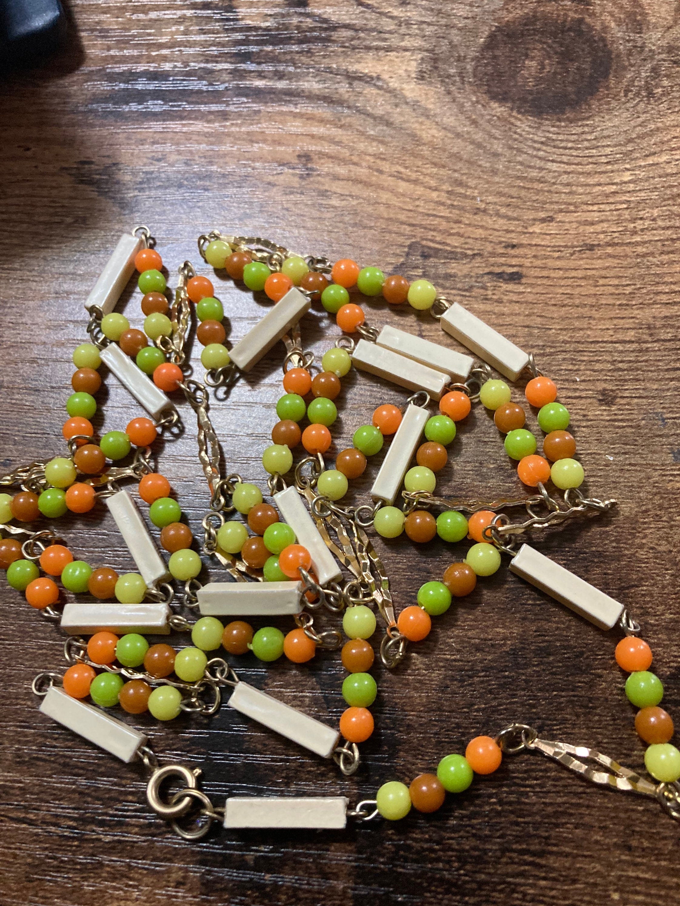 beaded flapper necklace bright orange and yellow plastic beads 140cm