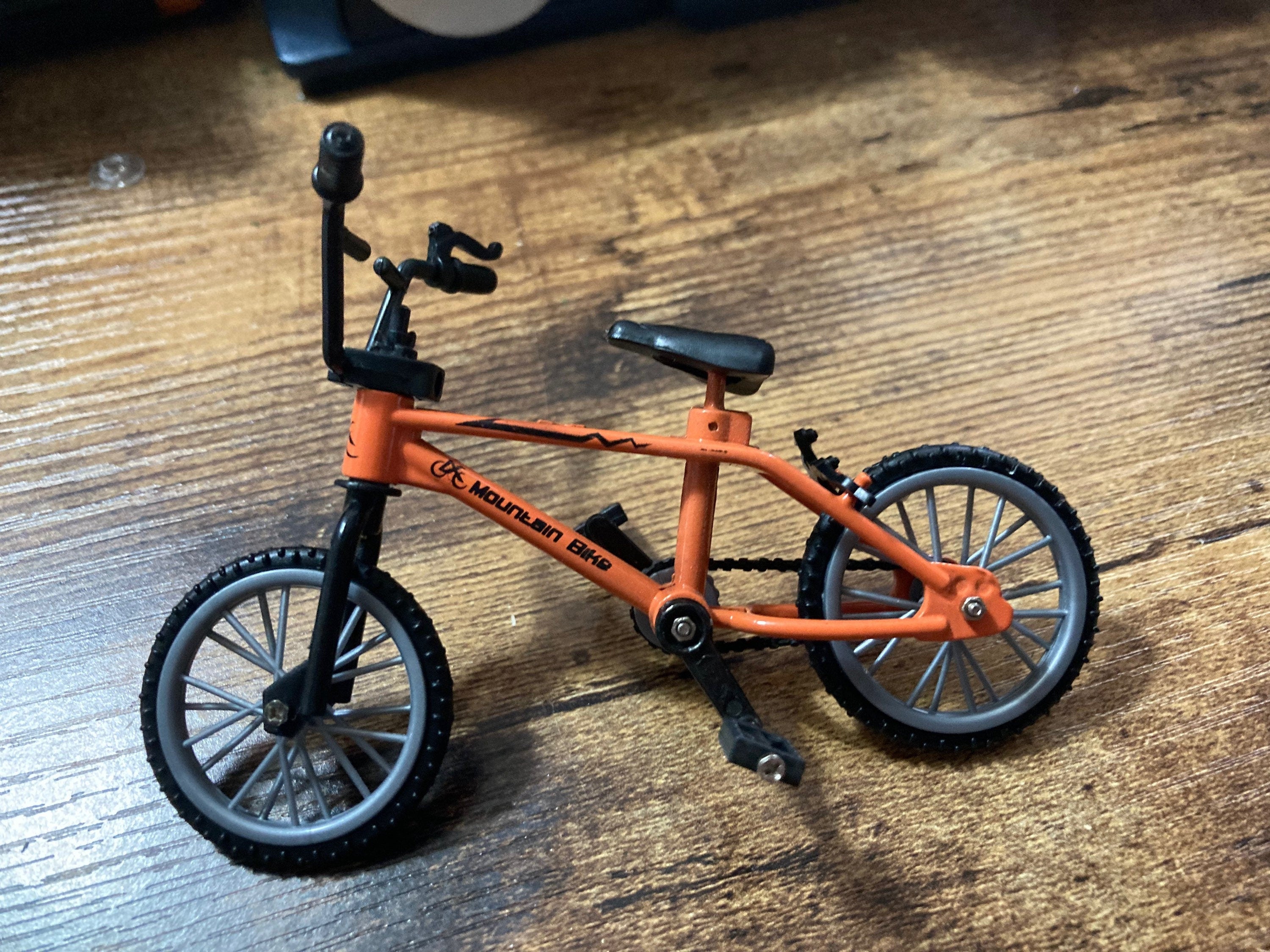 Miniature plastic orange mountain bike BMX cake topper decoration