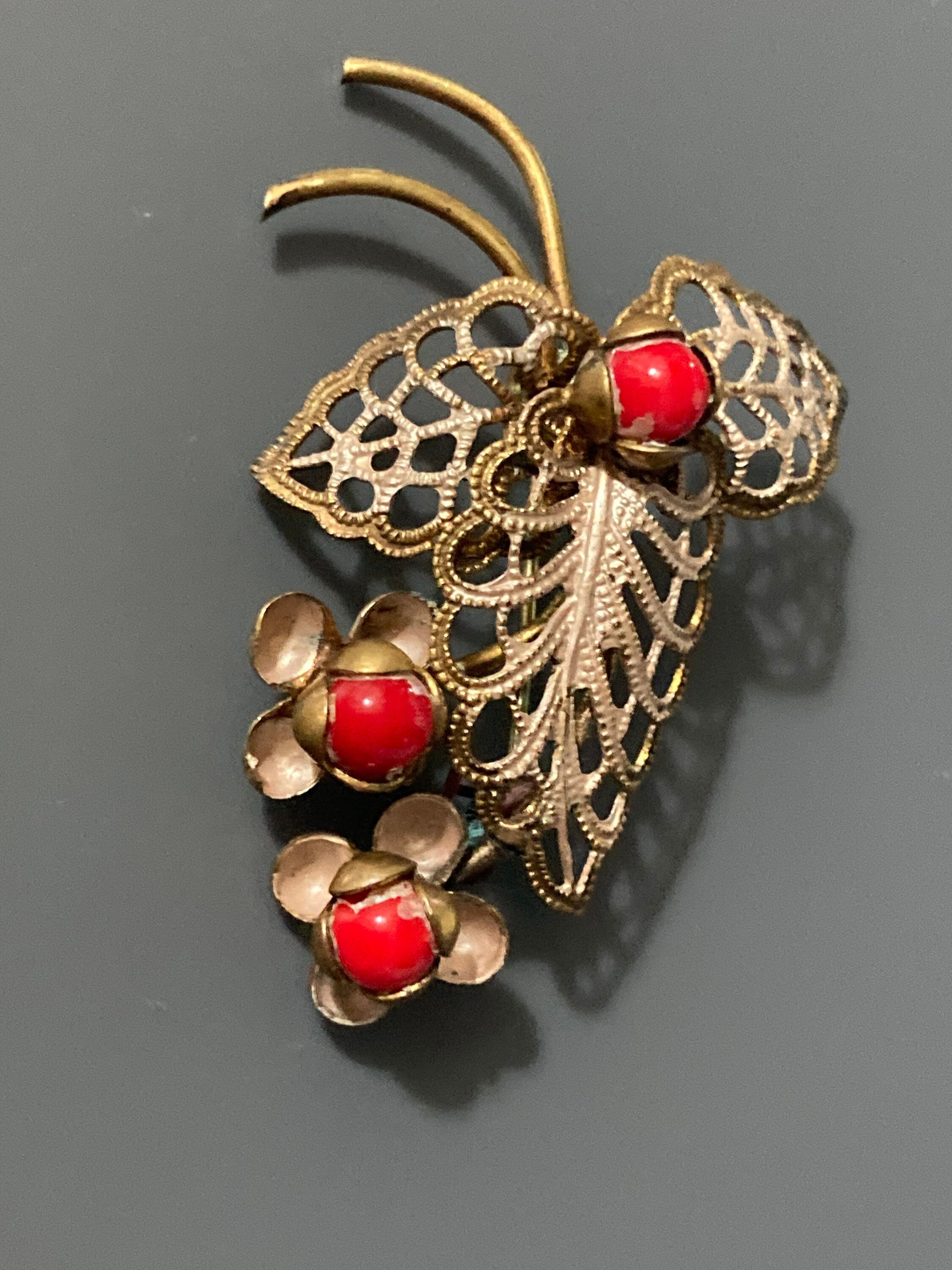 Art Deco Czech brass metal leaf brooch with faux red coral glass cabochon