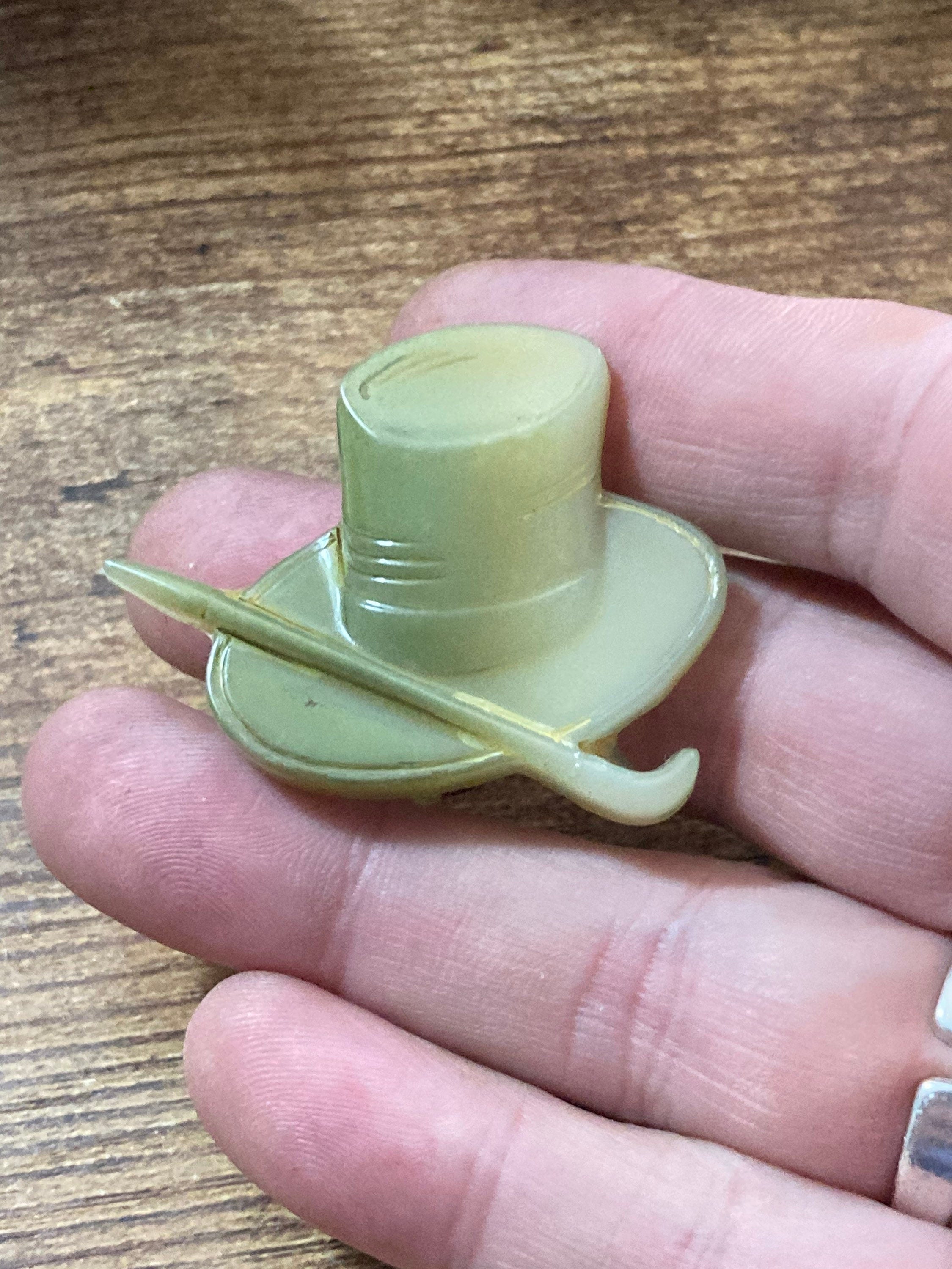 Early Plastic Celluloid Art Deco green mens top hat and cane brooch