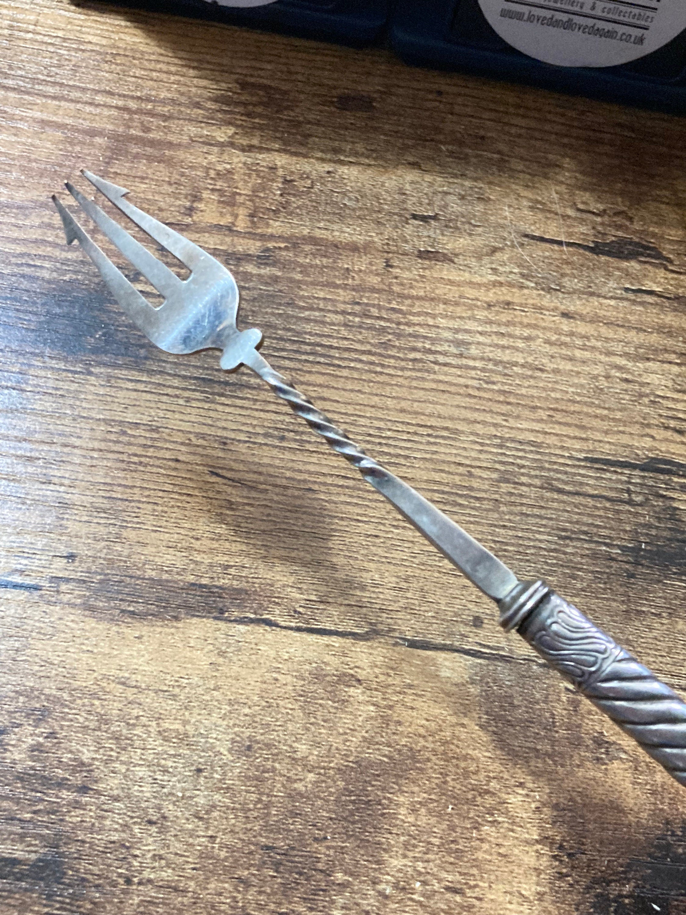 Unmarked silver white metal pickle fork