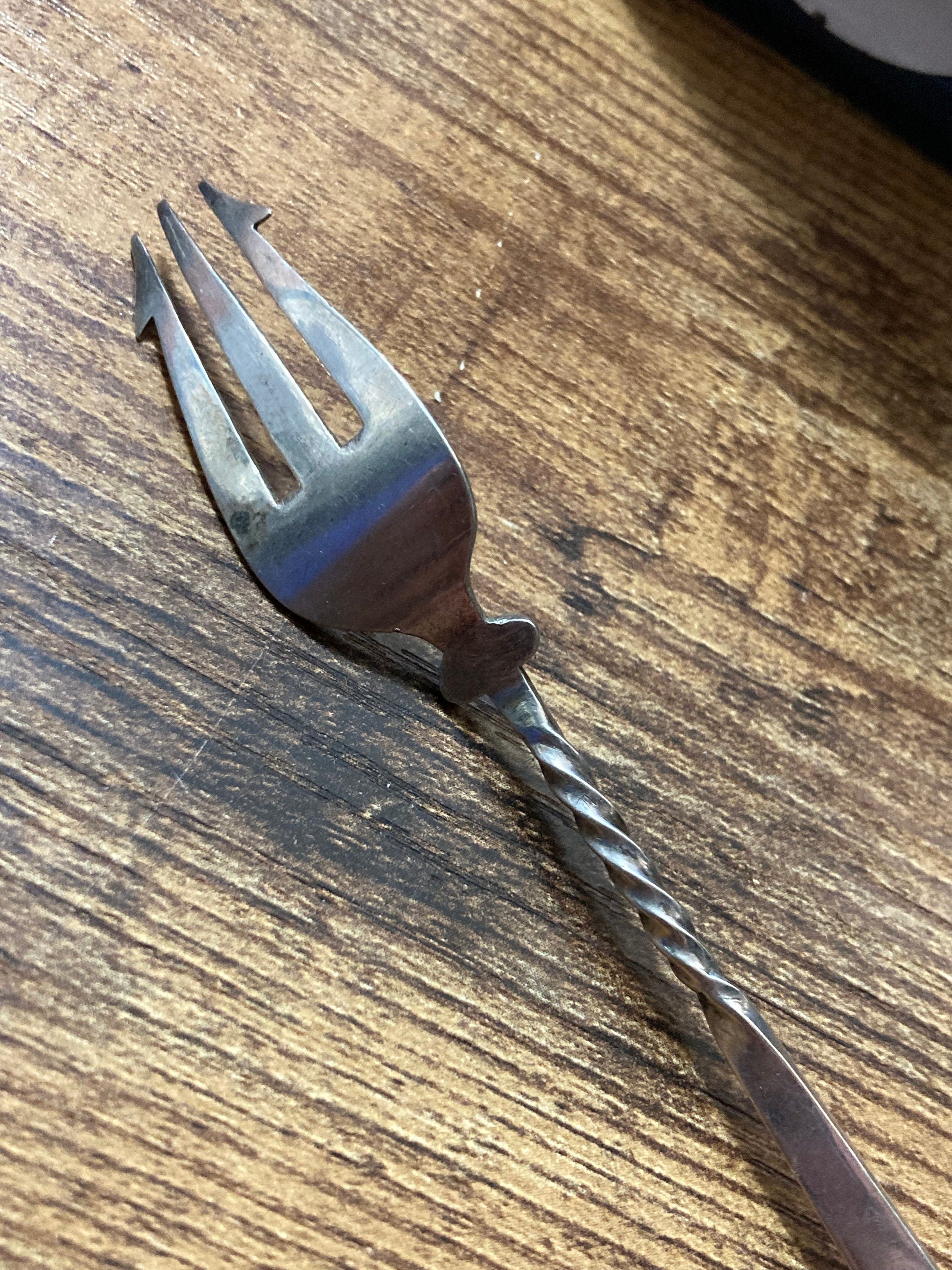 Unmarked silver white metal pickle fork