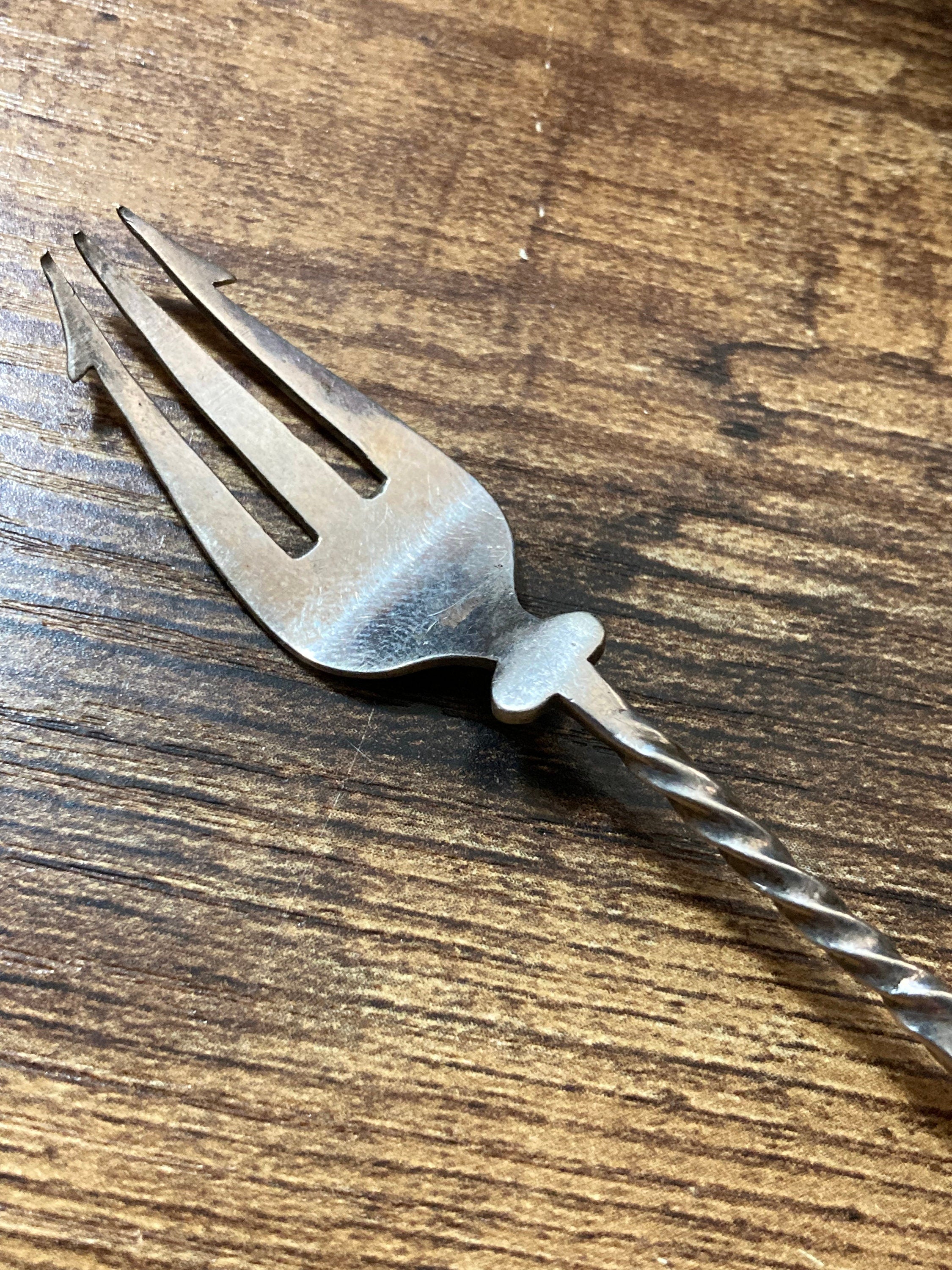 Unmarked silver white metal pickle fork