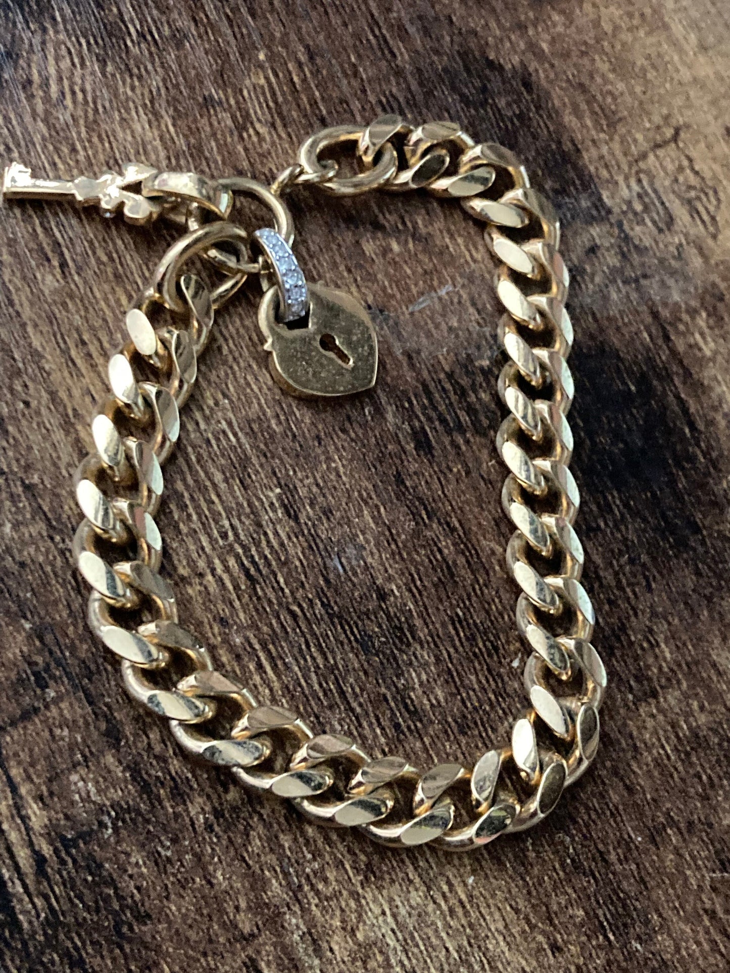 High end heavy gold plated chain link curb bracelet with diamanté heart and key charm