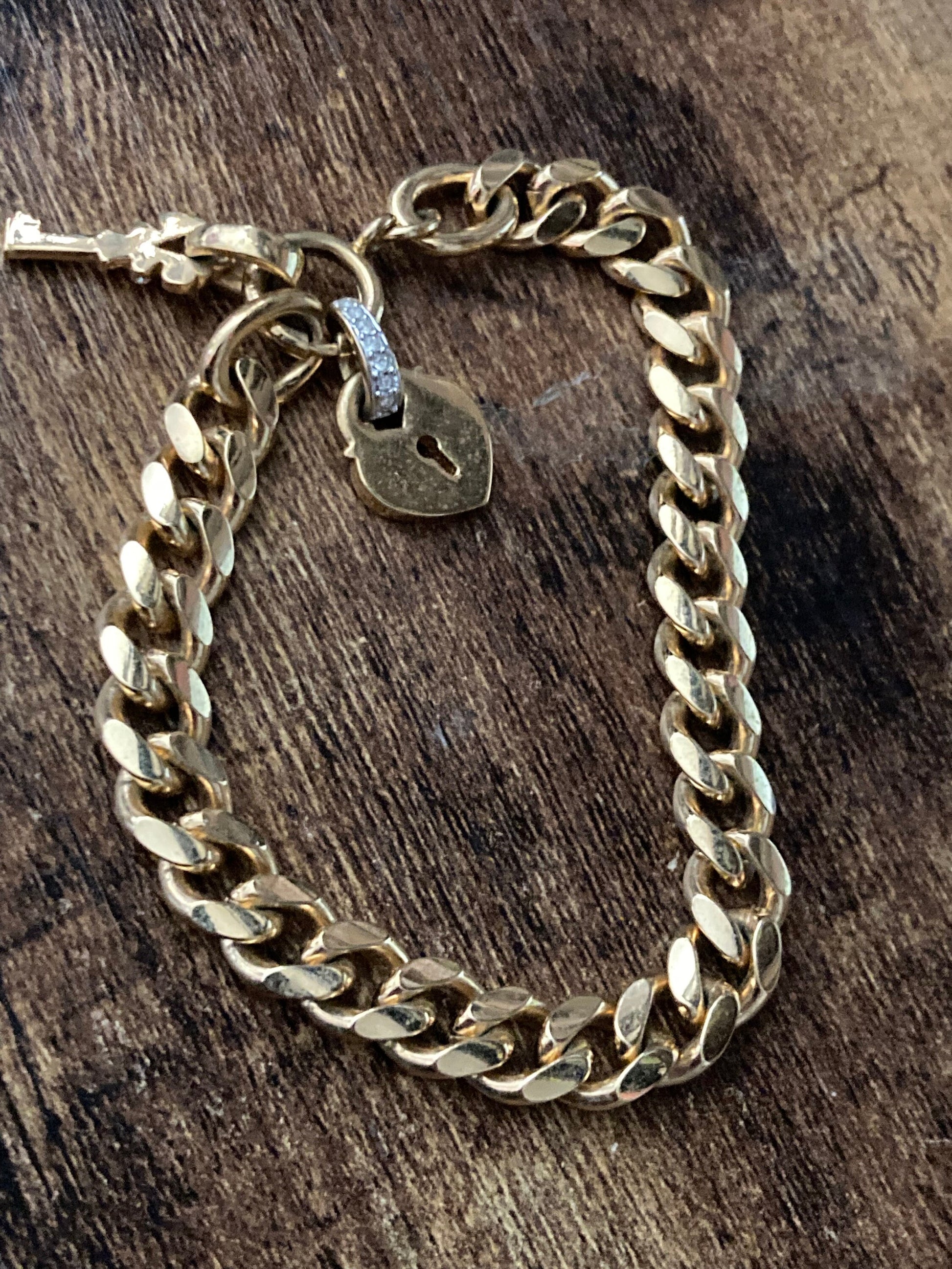 High end heavy gold plated chain link curb bracelet with diamanté heart and key charm