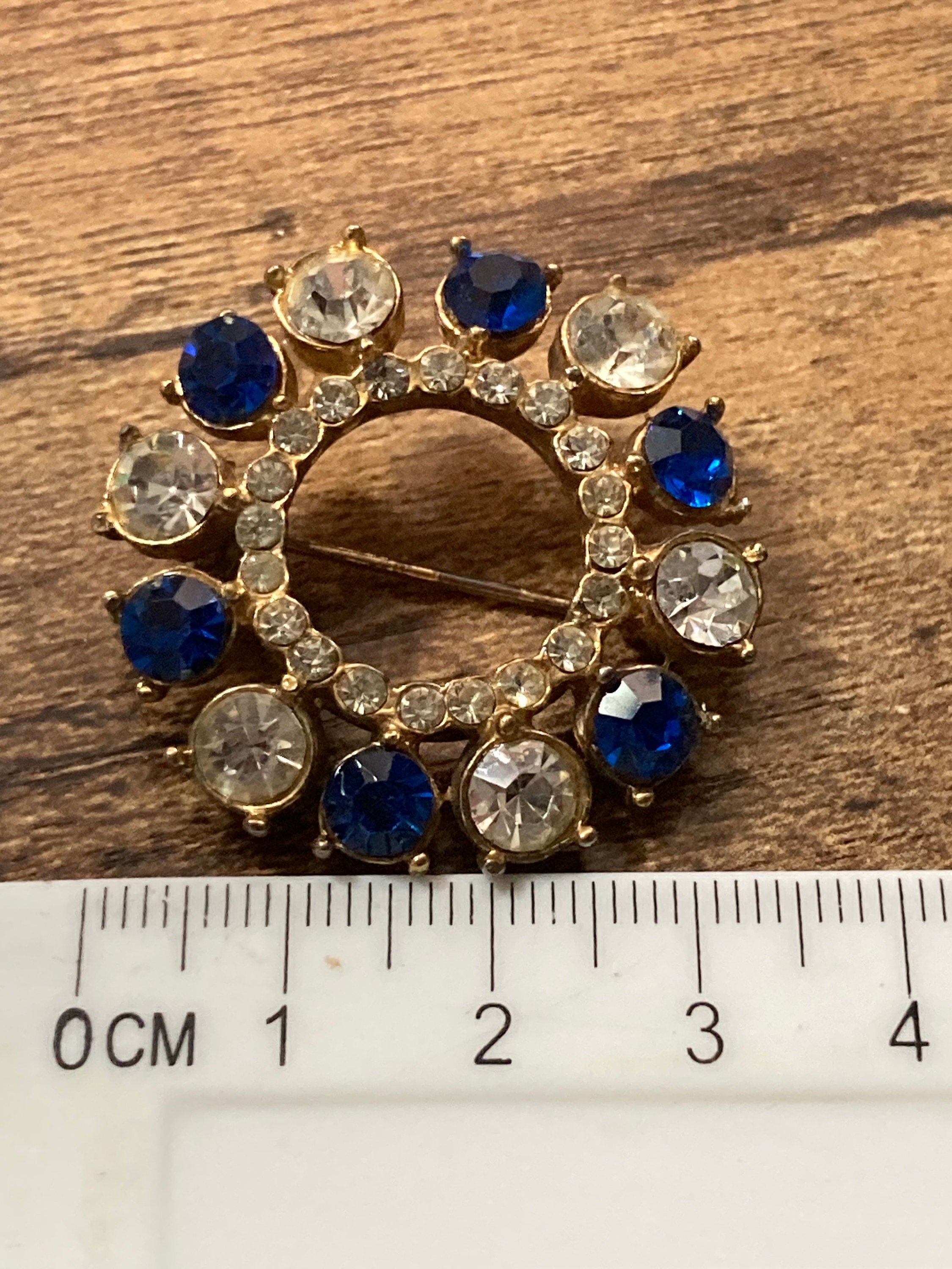 Vintage round rhinestone paste glass Diamanté gold tone Brooch with sapphire blue stones