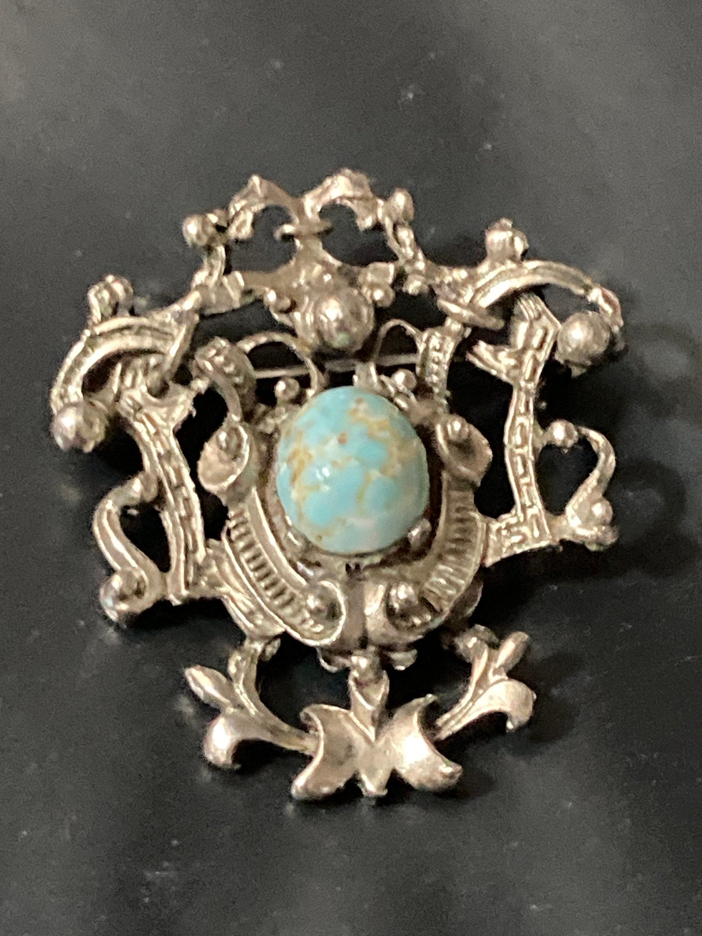 vintage silver tone ornate flirenza style brooch set with turquoise cabochon