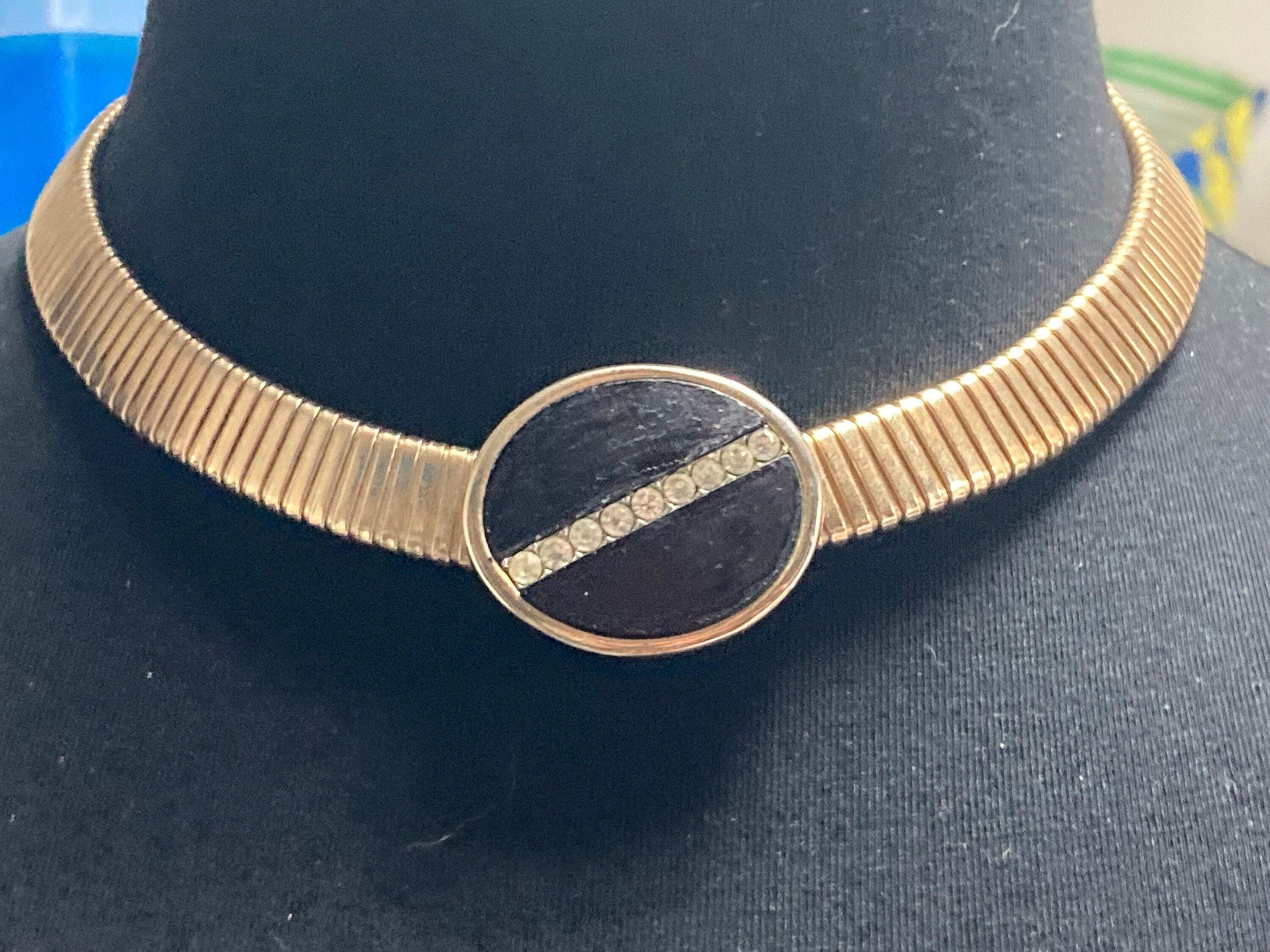 Signed park lane Gold tone omega choker necklace with black Oval diamanté cabochon