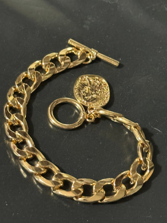 Retro gold tone chain link curb bracelet with faux medallion coin charm